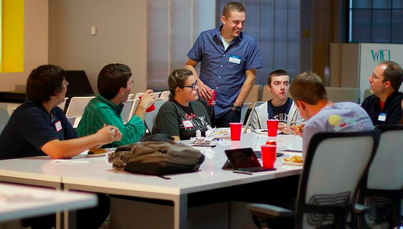 MECA Challenge students work with Dustin Abercrombie from VeriQuik. 