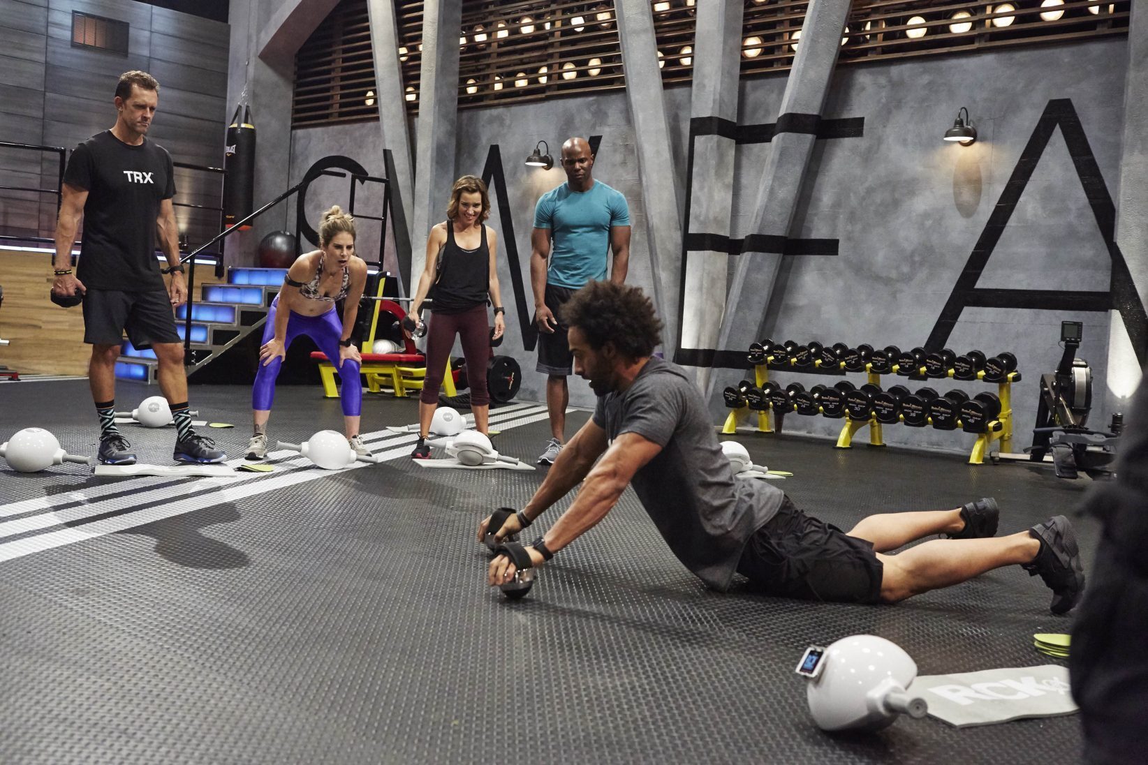 Tommy Saunders using his fitness system OmniBalls on Spike TV's Sweat Inc.