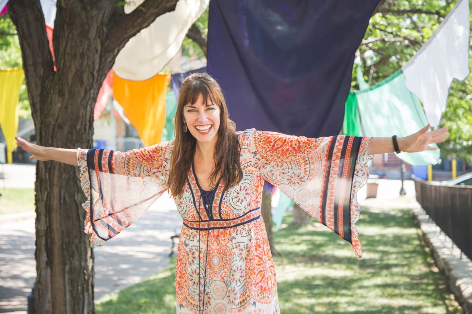 Victor & Penny musician Erin McGrane smiles in Kansas City's River Market. Photo by Bobby Burch
