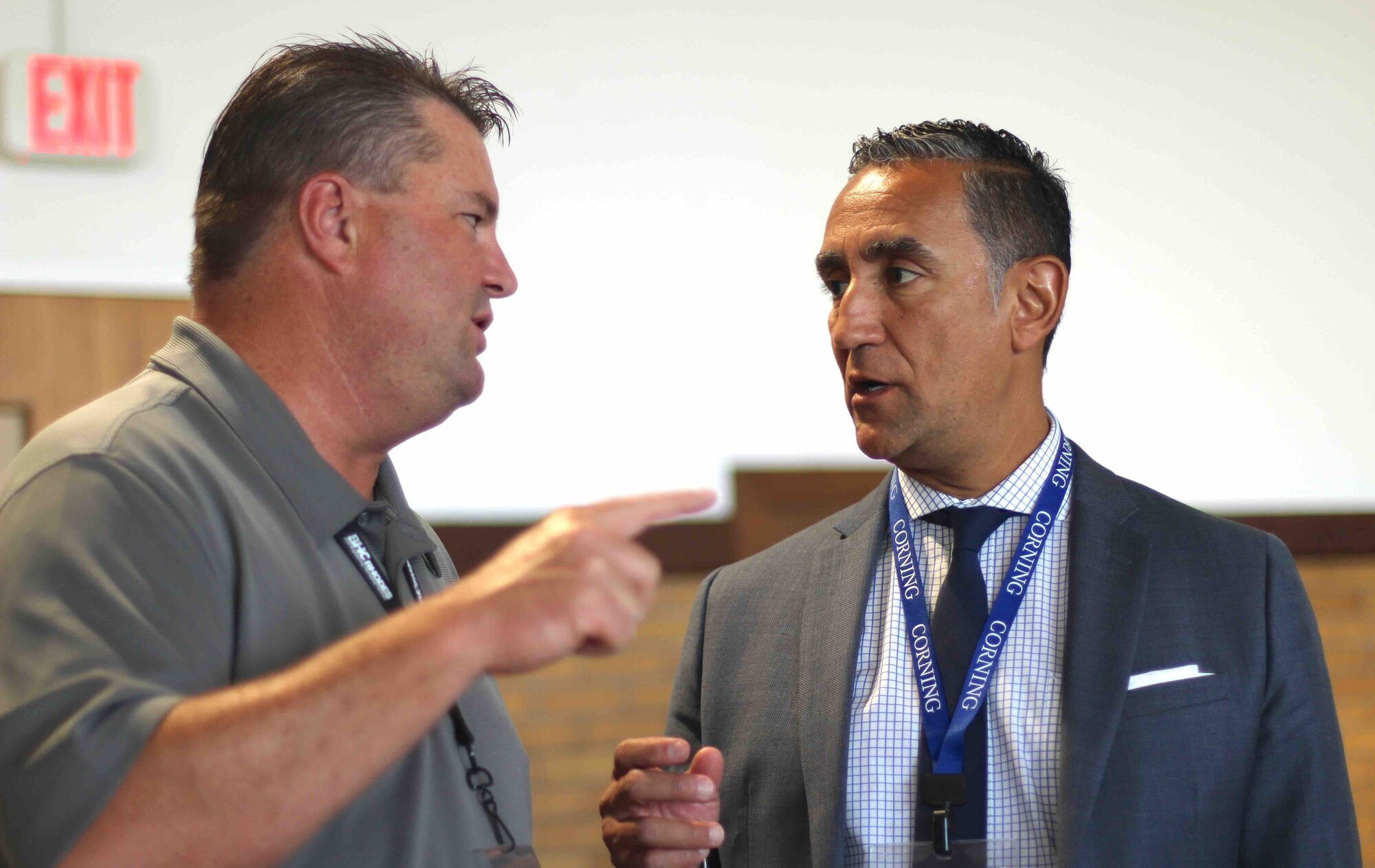 Two attendees chat at the Gigabit City Summit.