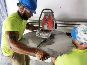 KC Coring cuts a hole in the safe at the future Bridge Space in Lee's Summit