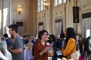 Kiffany Bosserman, owner of Cottontale and Cookies and Creamery, speaks with Shakia Webb, Ewing Marion Kauffman Foundation, during the Chamber's Small Business Showcase at Union Station