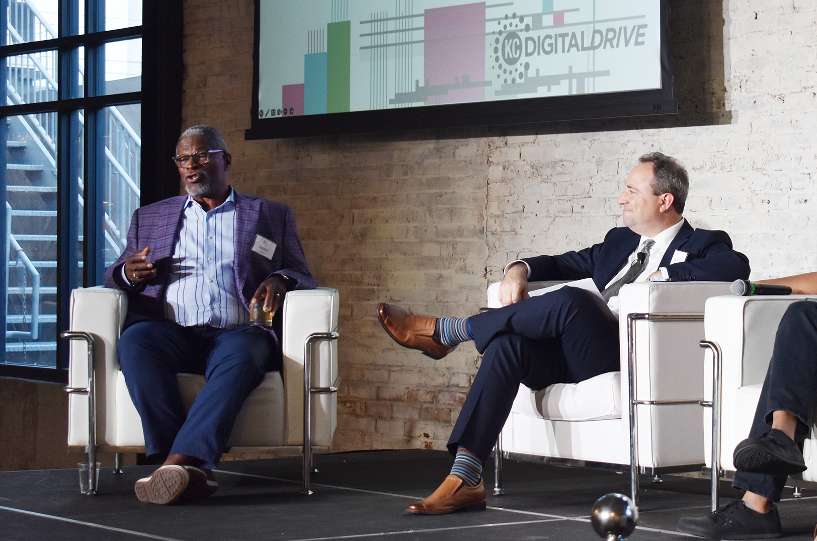 Sly James, former KCMO mayor, speaks alongside Aaron Deacon, KC Digital Drive, during an event celebrating KC Digital Drive's 10th anniversary
