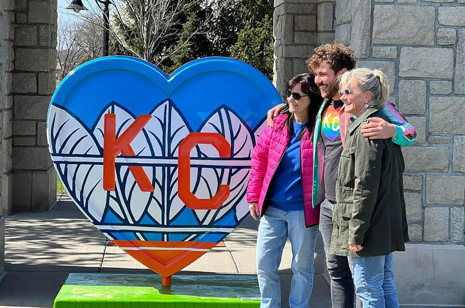 Kansas City artist Jared Horman poses with his Parade of Hearts piece in April 2022