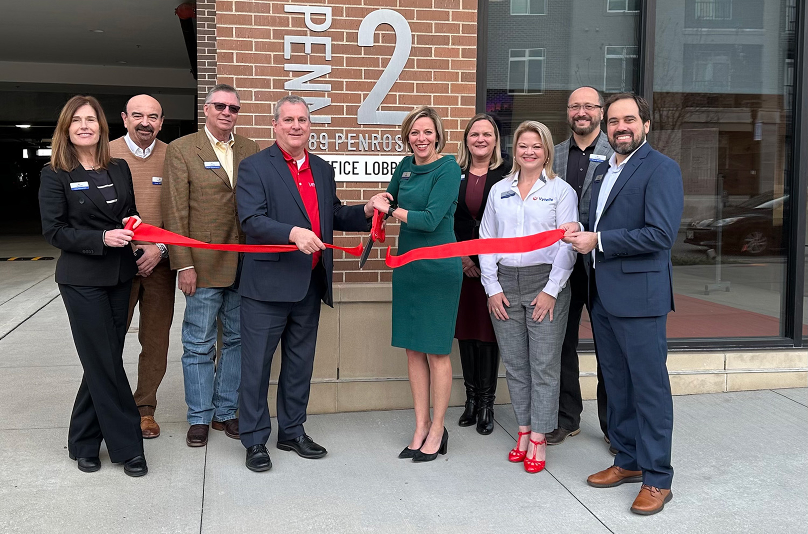 Vytelle's executive team and employees join with Michael Boehm, mayor of Lenexa, during a ribbon cutting event at Vytelle's new headquarters. Pictured: Lisa Rumsfeld, VP Business Strategy and Business Development; Rudy Leemans, Chief Financial Officer; Bryce Schumann, Technical Marketing Director; Michael Boehm, mayor of Lenexa; Kerryann Kocher, CEO of Vytelle; Katrin Bridges, Director of Administrative Operations; Lynn Lobe, Director of Human Resources; Trevor Gartner, VP, SENSE & INSIGHT Operations; and Bruno Sanches, VP of Operations Vytelle ADVANCE