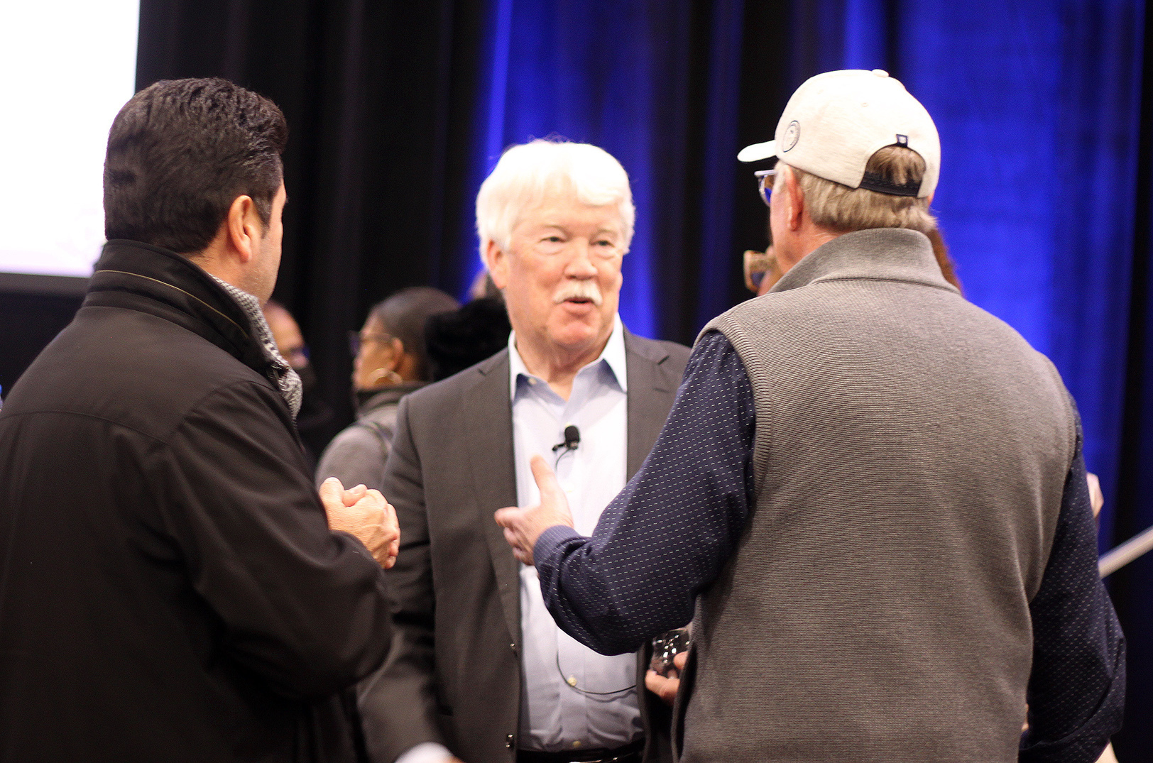 John Sherman, owner of the Royals, speaks with community members Tuesday evening at the Urban Youth Academy during the second in a series of public community meetings