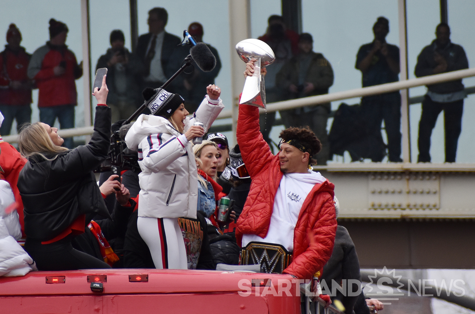 Kansas City Chiefs quarterback Patrick Mahomes celebrates amid the team's championship parade; photos by Tommy Felts, Startland News