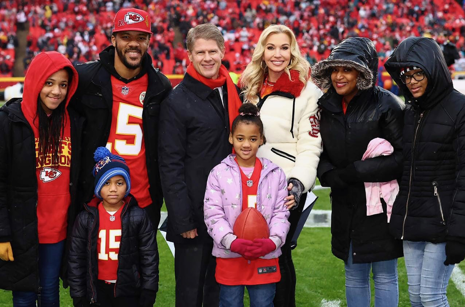 The Rhone family with daughter, Layla, center, pictured here at the Kansas City Chiefs first playoff game, along with Chiefs CEO, Lamar Hunt and wife, Tavia Shackles