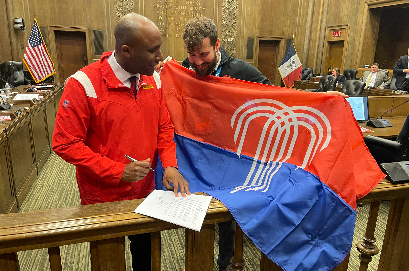 Mayor Quinton Lucas and Jared Horman display the new municipal flag of Kansas City, Missouri