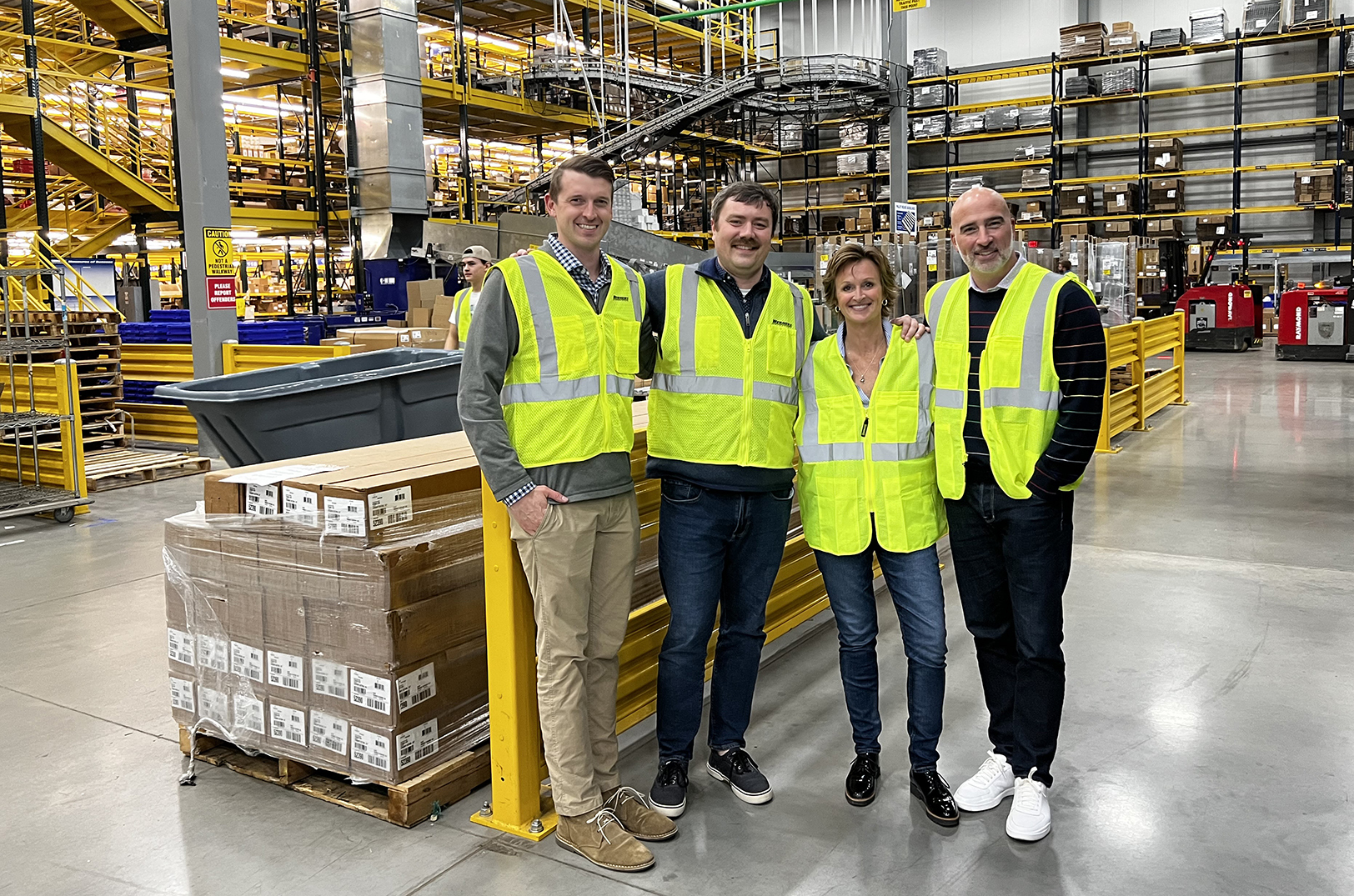 Megan O'Rear, center right, and the Celerity Enterprises team on-site in a client's space