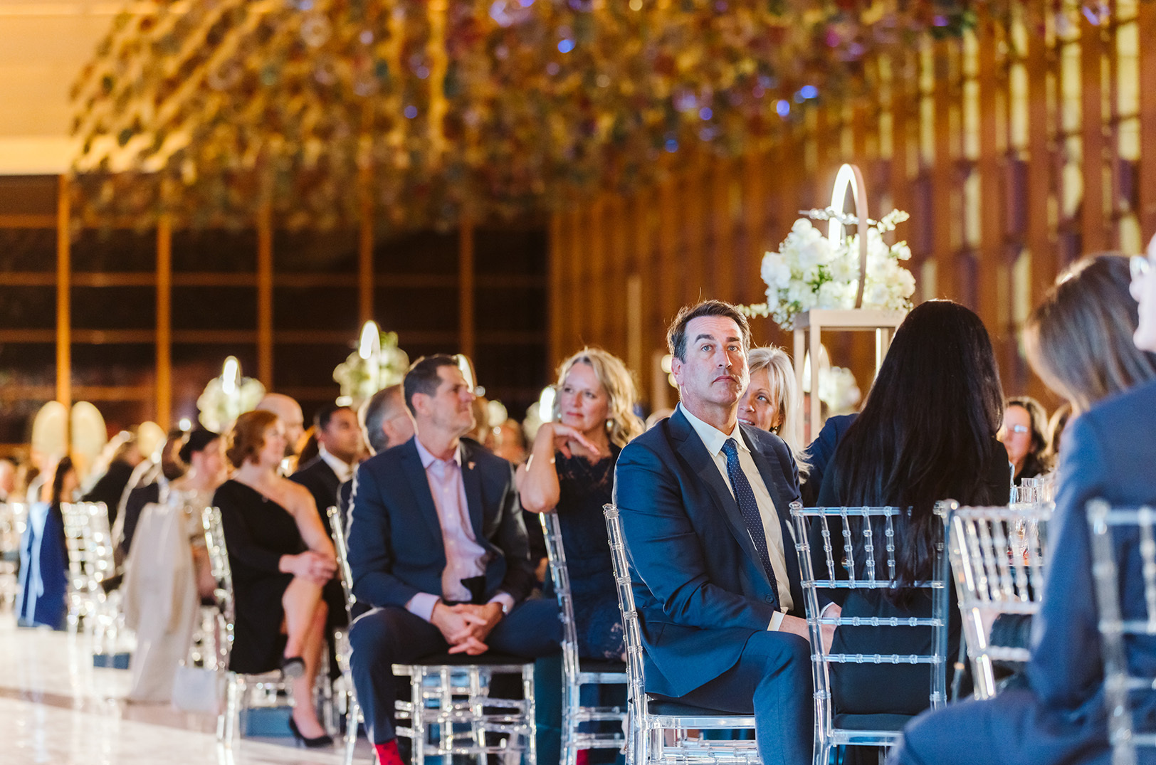 Event emcee, comedian, and Kansas City native Rob Riggle sits among the crowd at a private gala celebration of KCI's new airport terminal; photo by Adri Guyer, PlatinumXP