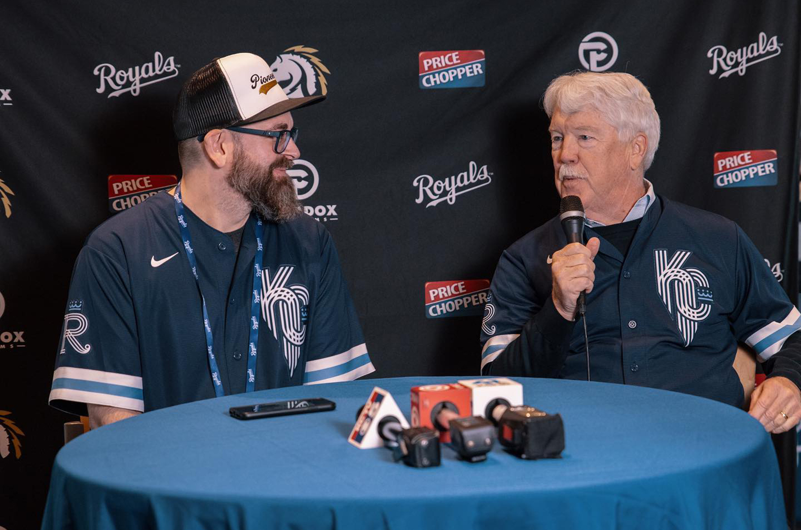 Mark Josey, CEO of the KC Pioneers, talks with John Sherman, owner of the Kansas City Royals, during an April 2022 Pioneers bootcamp at Kauffman Stadium