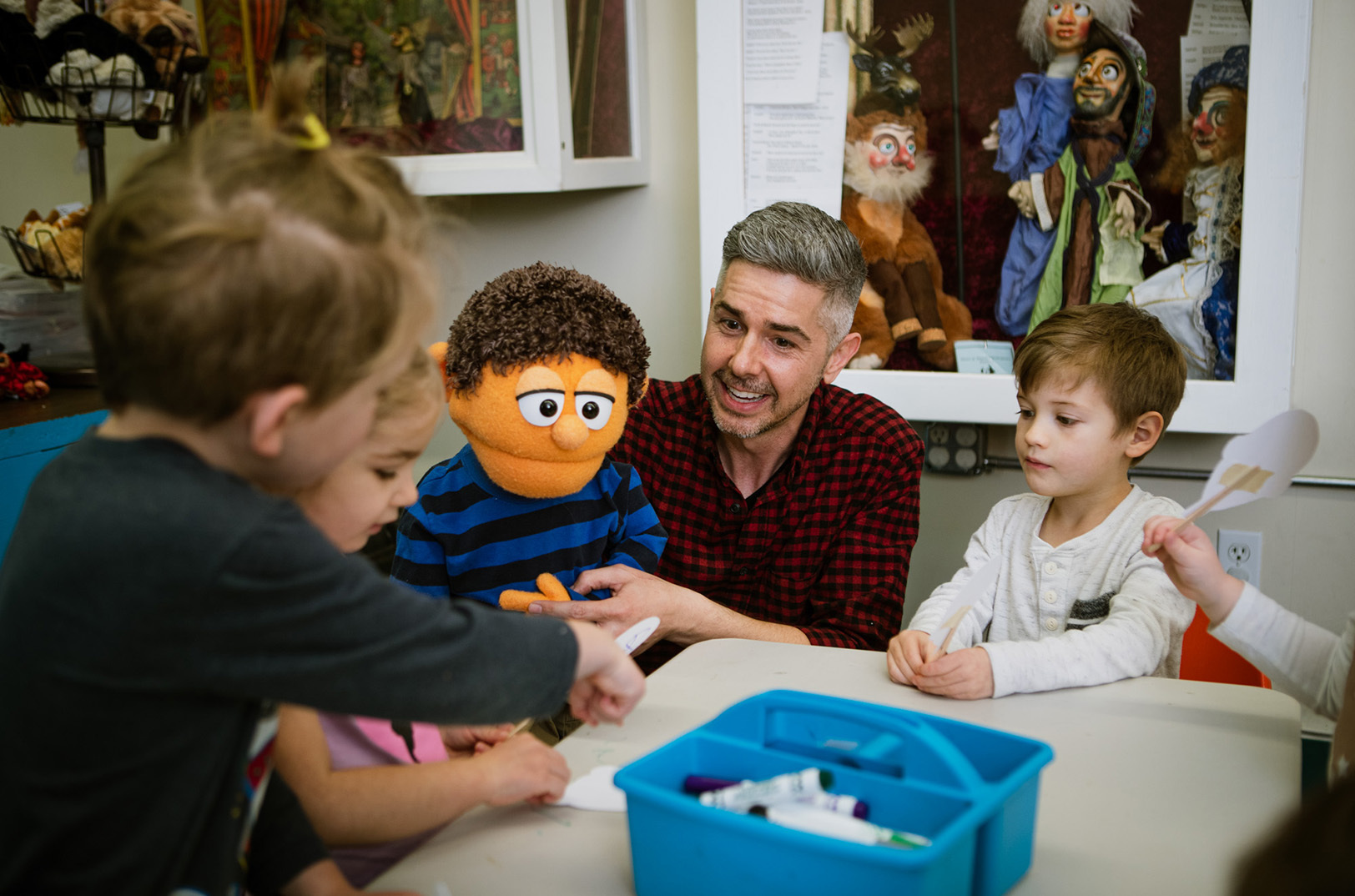 Alex Espy, director of education for What If Puppets, works with preschool students; photo courtesy of What If Puppets