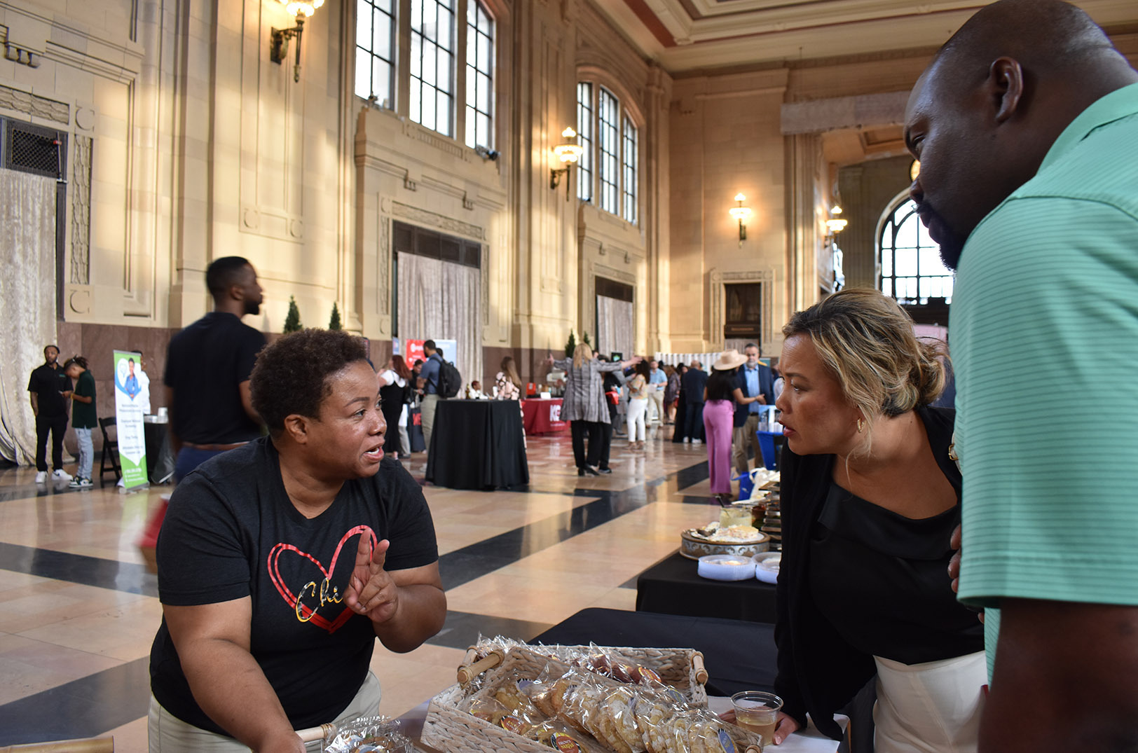 Event-goers at the KC Chamber's Small Business Showcase sample cookies from Brown Suga Bakes in the Grand Hall at Union Station; photos by Channa Steinmetz, Startland News