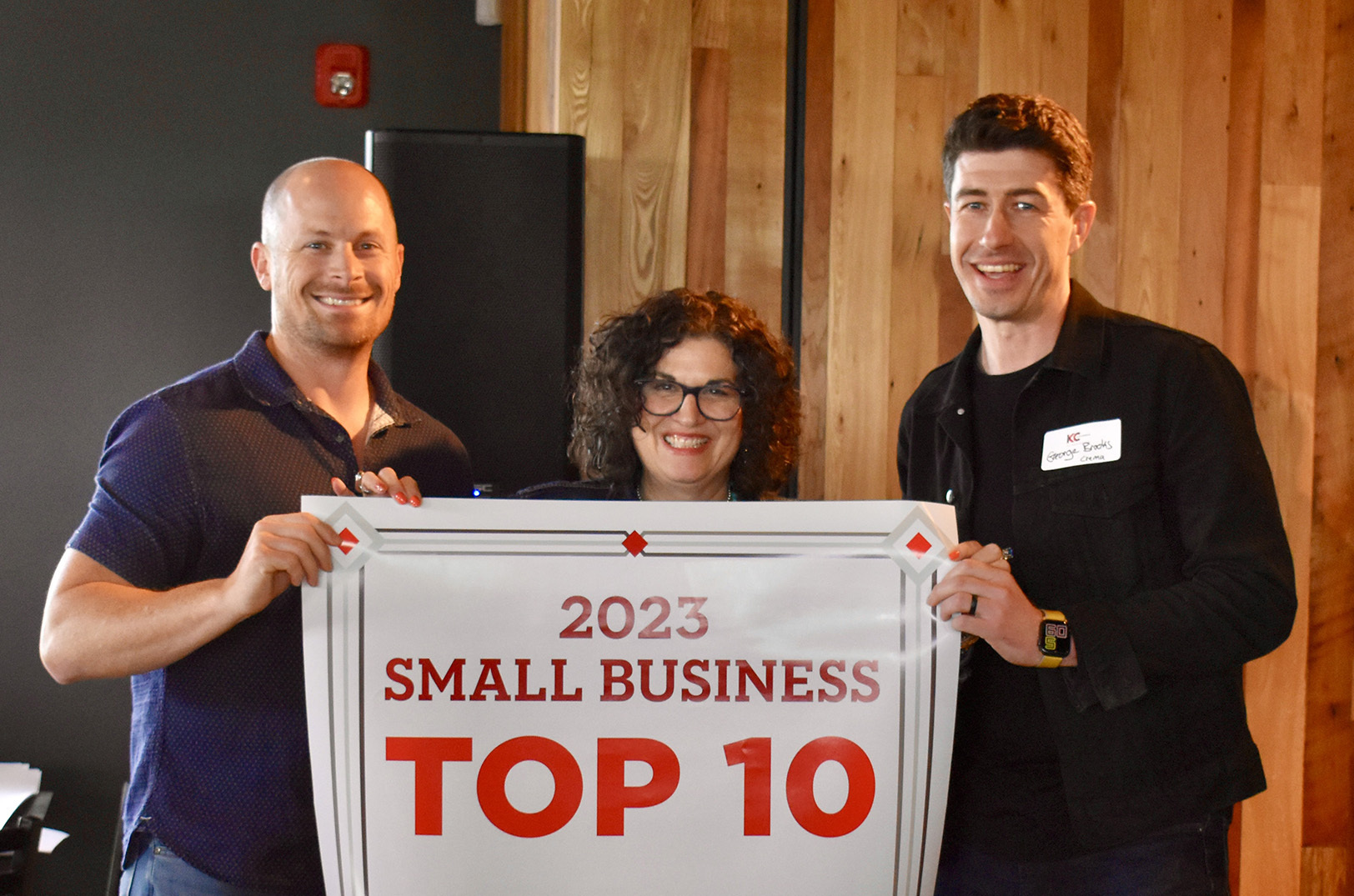 Dan Linhart, Crema; Vicky Kulikov, Greater Kansas City Chamber of Commerce; and George Brooks, Crema; at a reveal party for the 2023 Small Business of the Year Top 10; photos by Nikki Overfelt Chifalu