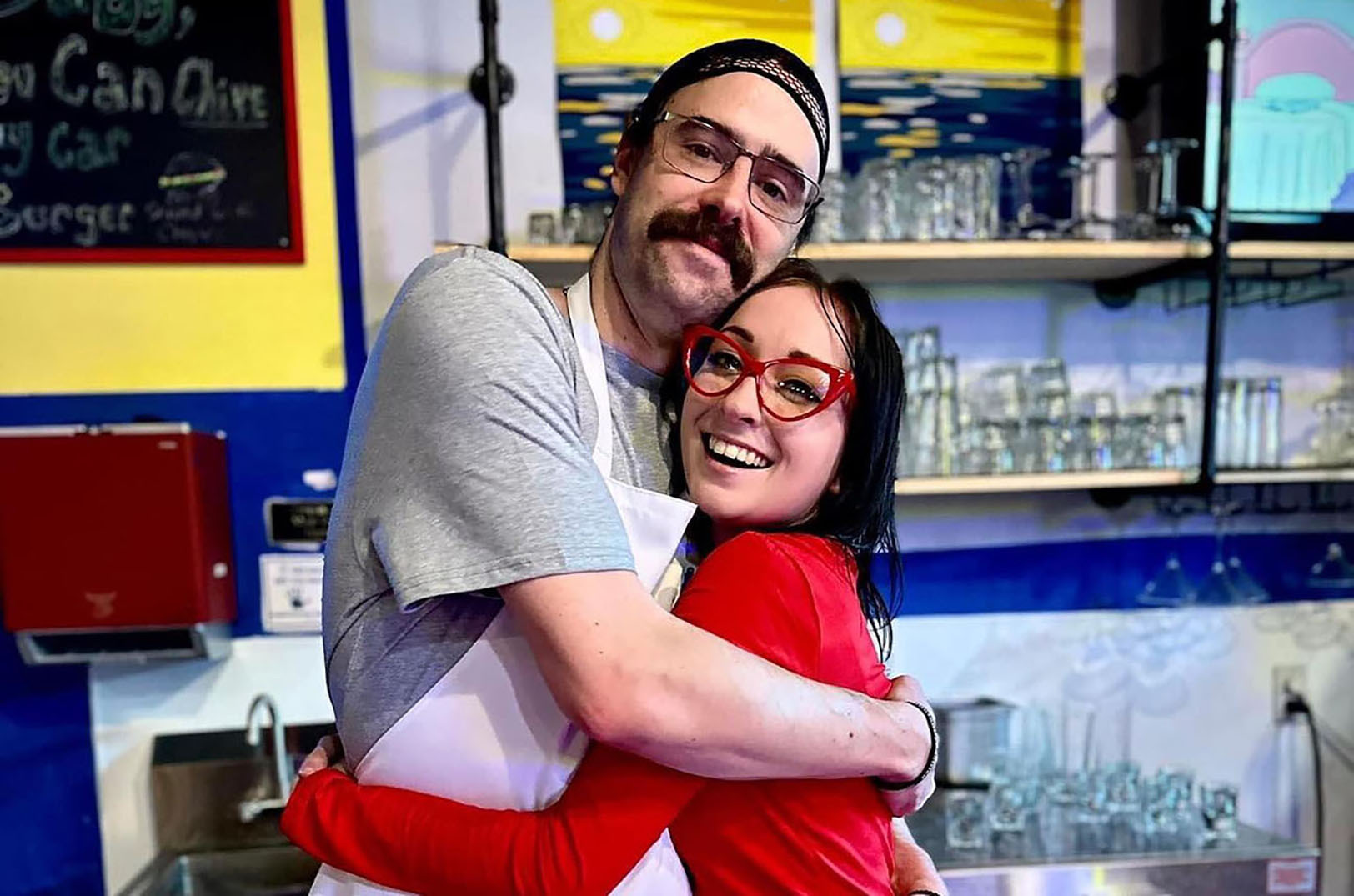 Bar manager Scott Helling and bartender Delaney Rose pose together as characters Bob and Linda Belcher at Bob’s BARgers pop-up at Vignettes Cocktail Bar; photo courtesy of Vignettes Cocktail Bar
