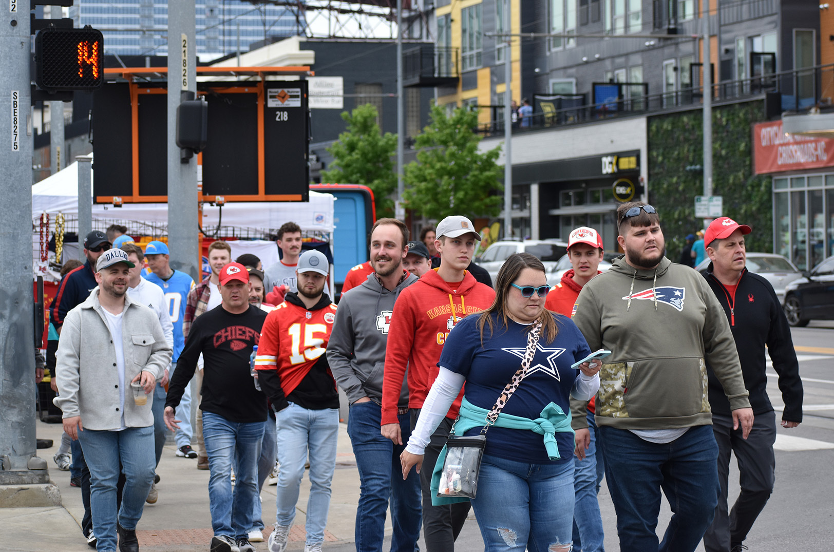 Fans decked out for the NFL Draft walk through the Crossroads Thursday on their way toward Union Station and the NFL Draft event grounds; photo by Austin Barnes, Startland News