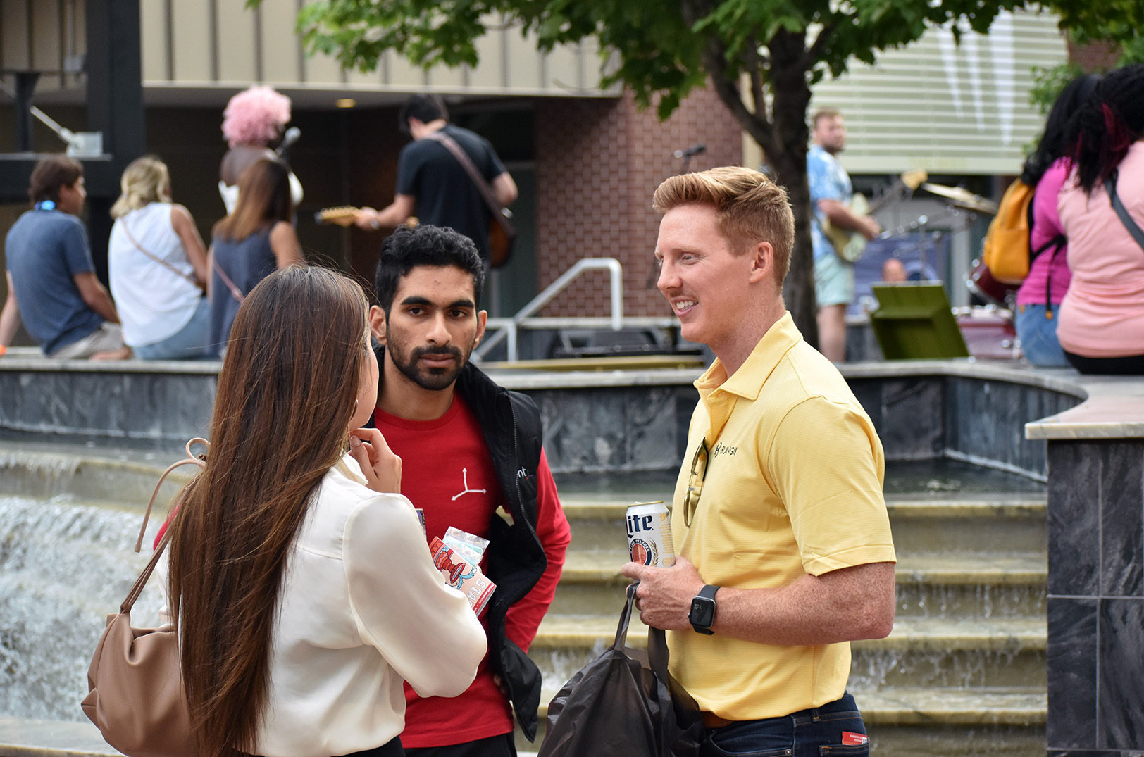 Event-goers — including founders Nikil Ragav, InventXYZ, and Harrison Proffitt, Bungii — gather at PNC Plaza during the 2023 Startup Crawl in downtown Kansas City; photo by Tommy Felts, Startland News