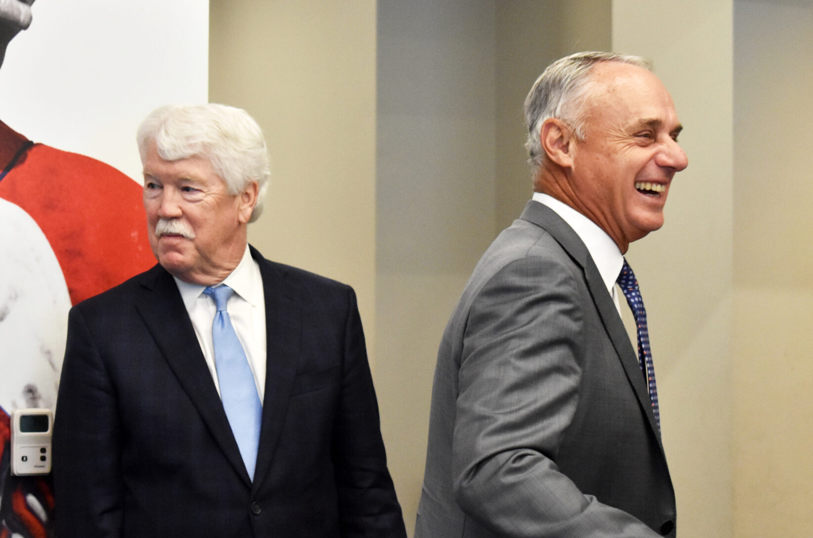 Rob Manfred, Major League Baseball commissioner, right, greets sports fans and others gathered during a visit to Kansas City; Royals Chairman and CEO John Sherman looks on; photos by Channa Steinmetz, Startland News