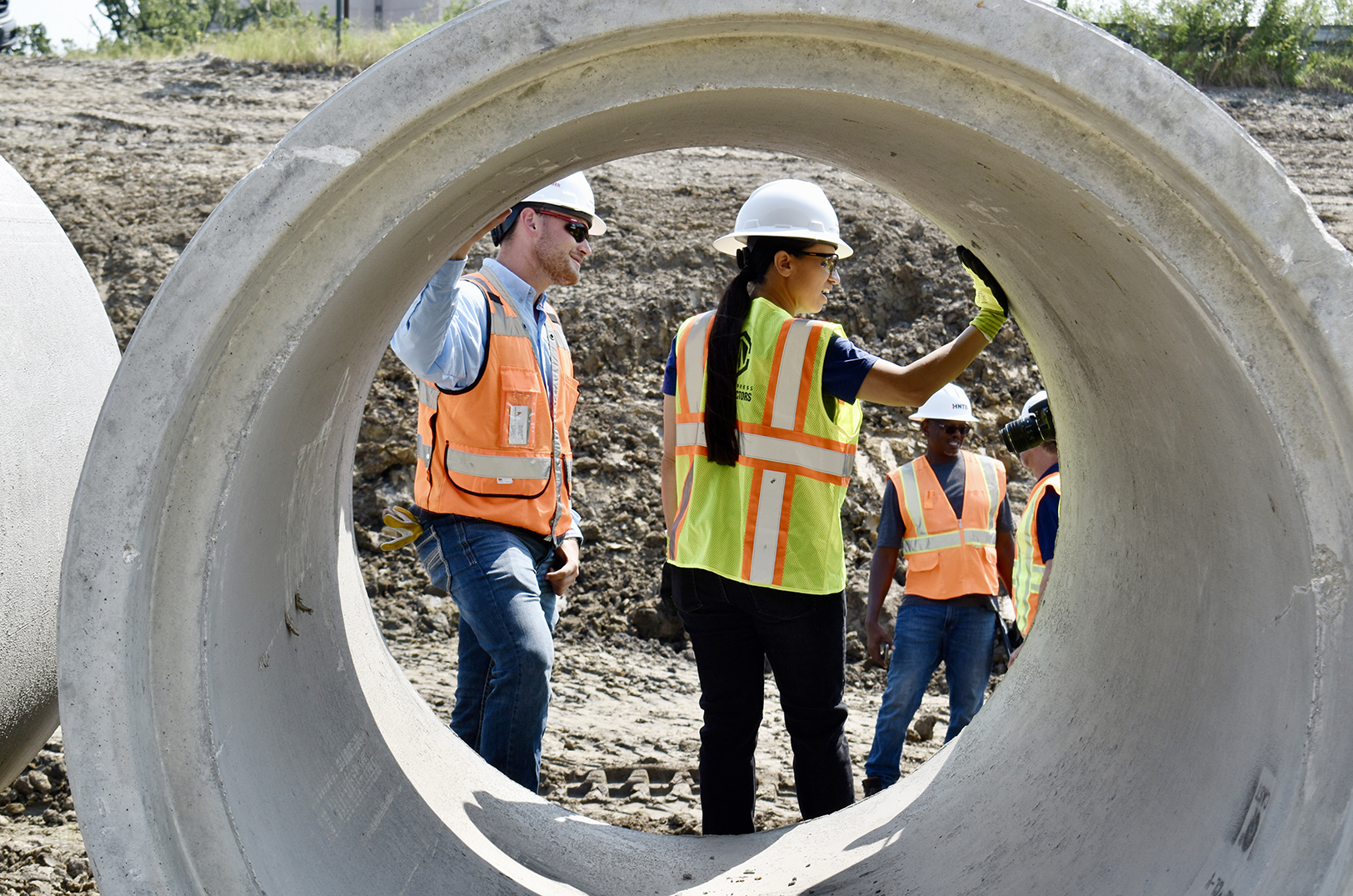 U.S. Rep. Sharice Davids, D-Kansas, right, tours the U.S. 69 Expansion Project (69Express) site with Sawyer Junker, Ames Construction and US69 Express Constructors; photo by Nikki Overfelt Chifalu, Startland News