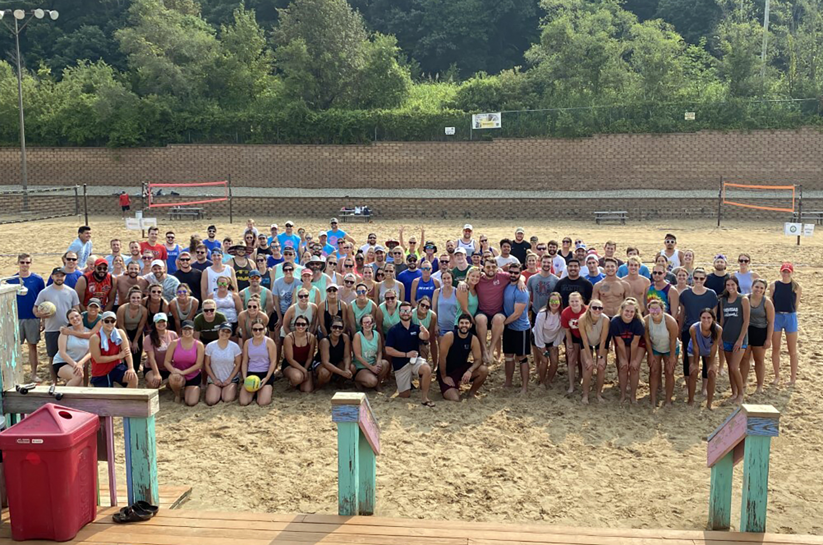 Group photo from a previous Go Further Foundation sand volleyball event