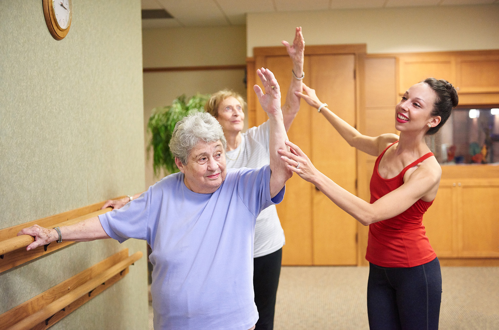 Vanessa Woods, Vitality in Motion, assists adult students in one of her bi-weekly ballet classes; photo courtesy of Vanessa Woods