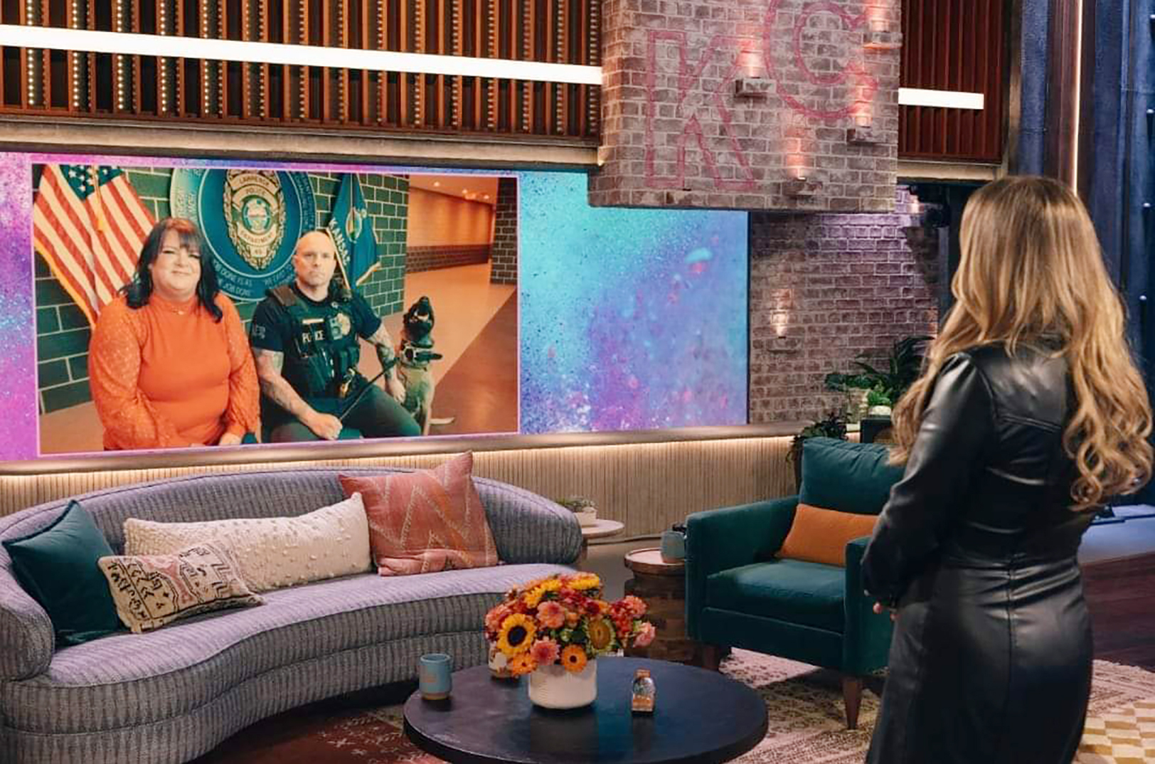 Emily Fawcett, Lawrence Police Department Cpl. Kevin Henderson and K-9  officer Mack appear on "The Kelly Clarkson Show"; image courtesy of Emily Fawcett