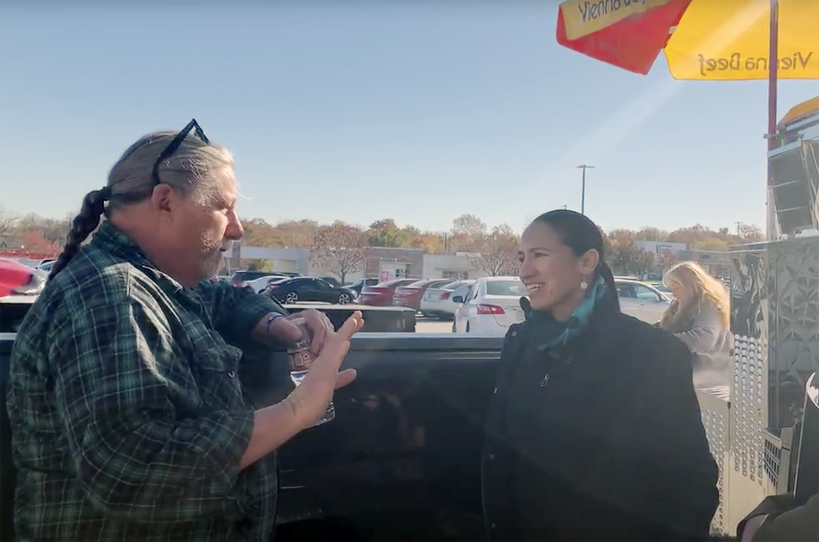 Brian Newton, Morty's, chats with U.S. Rep. Sharice Davids, D-Kansas, as he prepares his cart for daily operations; photo courtesy Sharice Davids' office
