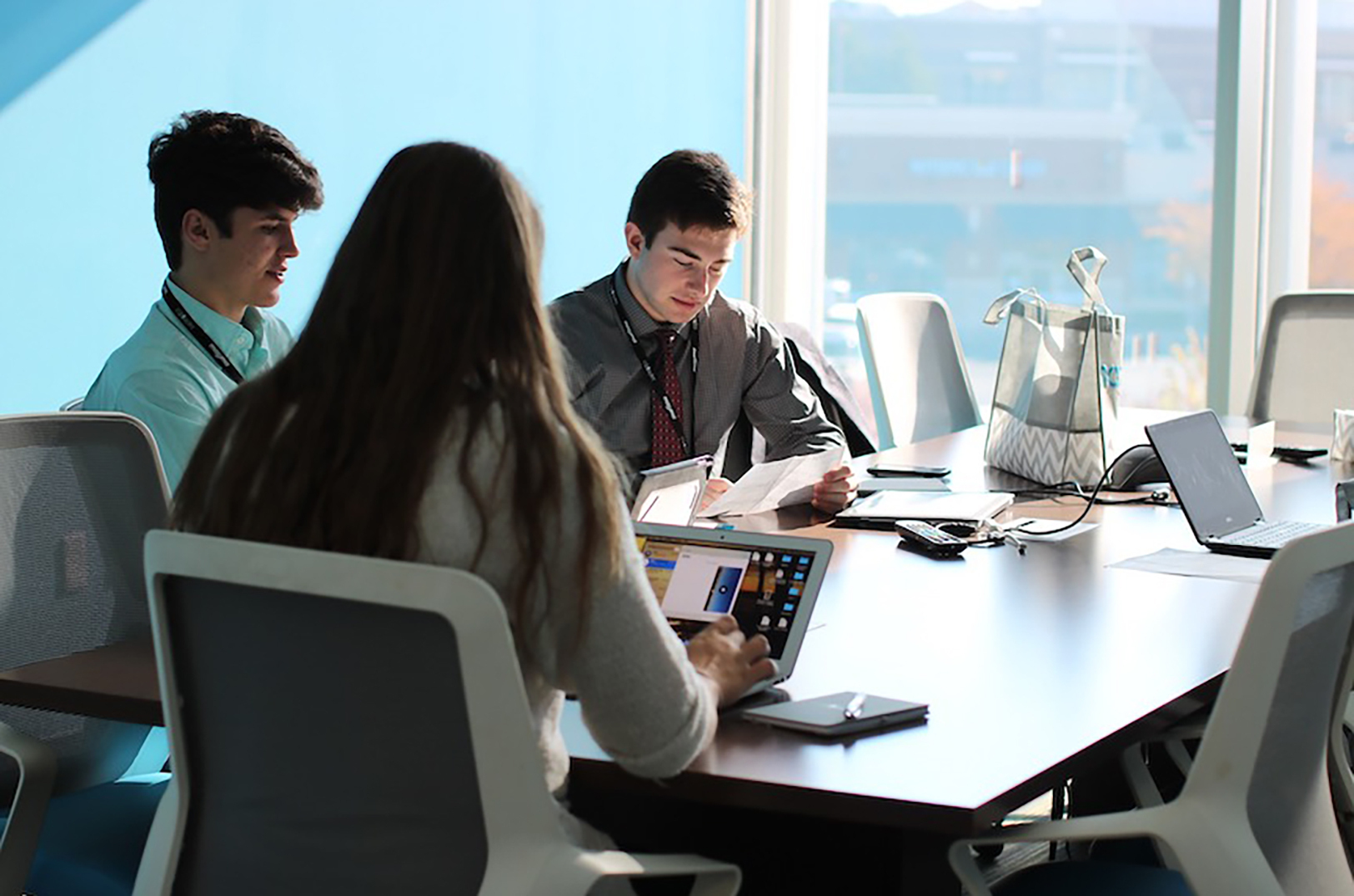 CAPS students participating in a hackathon sponsored by Mazuma; photo courtesy of CAPS Network