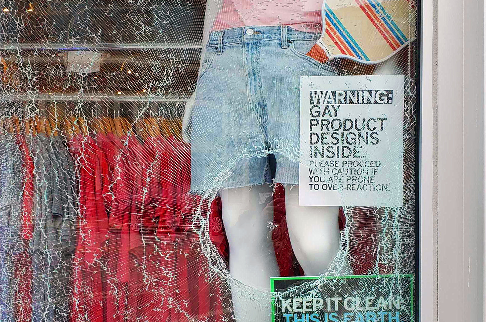 The "holiday hole" left after a vandal threw a rock in a sock at the window of Raygun in the Crossroads; photo courtesy of Raygun