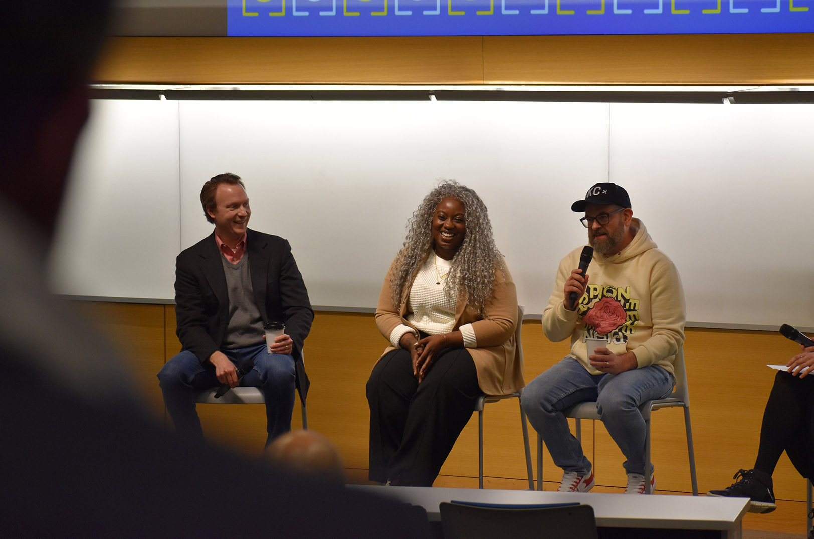 Mark Josey, Social Apex Media, shares a laugh with Jack Laskowitz, PayIt, and social media strategist Mikita Burton during a Marketing Your Startup in 2024 panel at Startland News’ Kansas City Startups to Watch in 2024 seminar and reception; photo by Tommy Felts, Startland News