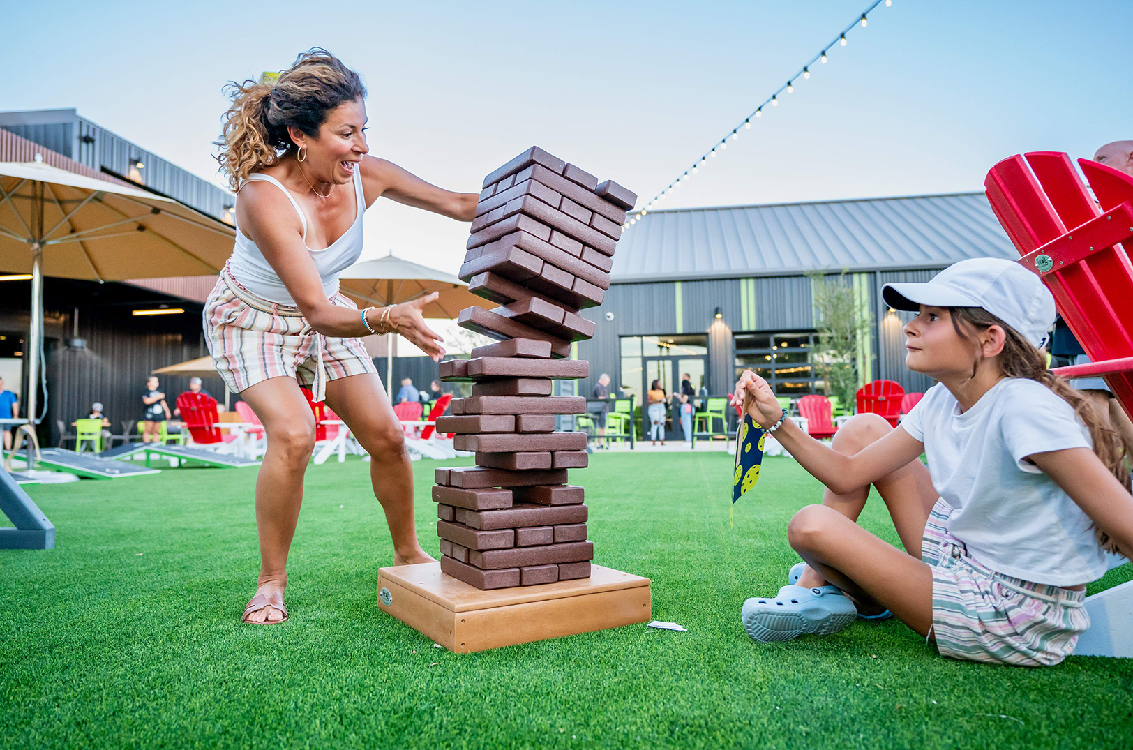 A duo enjoys a game of Jenga at Chicken N Pickle in Glendale, Arizona; photo courtesy of Chicken N Pickle