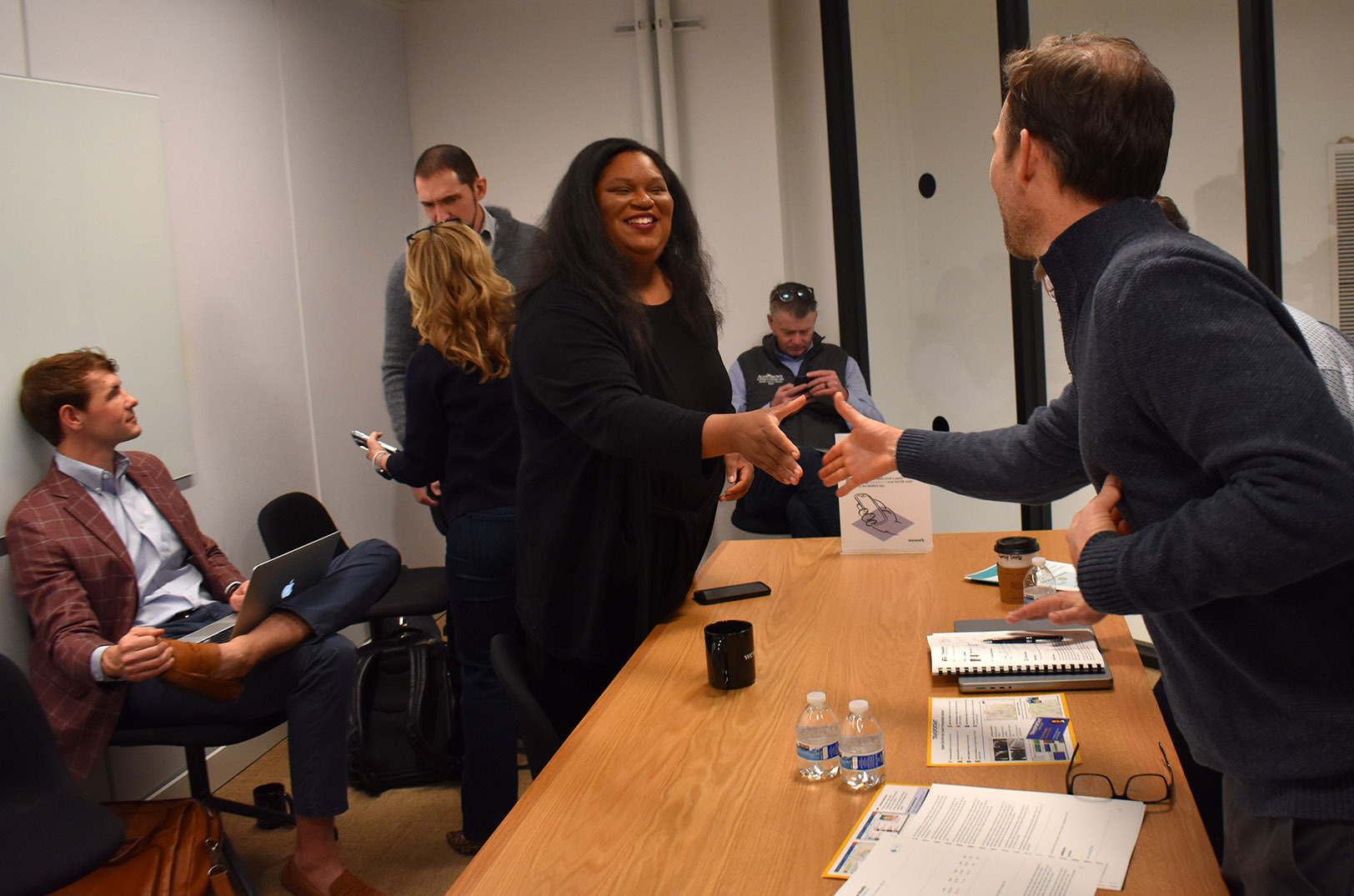 Emily Brown, Attane Health, shakes hands with Endeavor selection panel judges during Endeavor Heartland's first Kansas City selection event; photo by Taylor Wilmore, Startland News