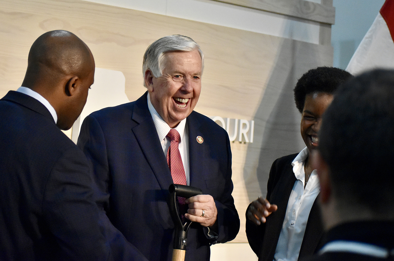 Gov. Mike Parson, R-Missouri, center, shares a laugh with KCMO Mayor Quinton Lucas and Monique Picou, global vice president of cloud supply chain and operations for Google, at announcement event for Google's new data center; photo by Nikki Overfelt Chifalu, Startland News