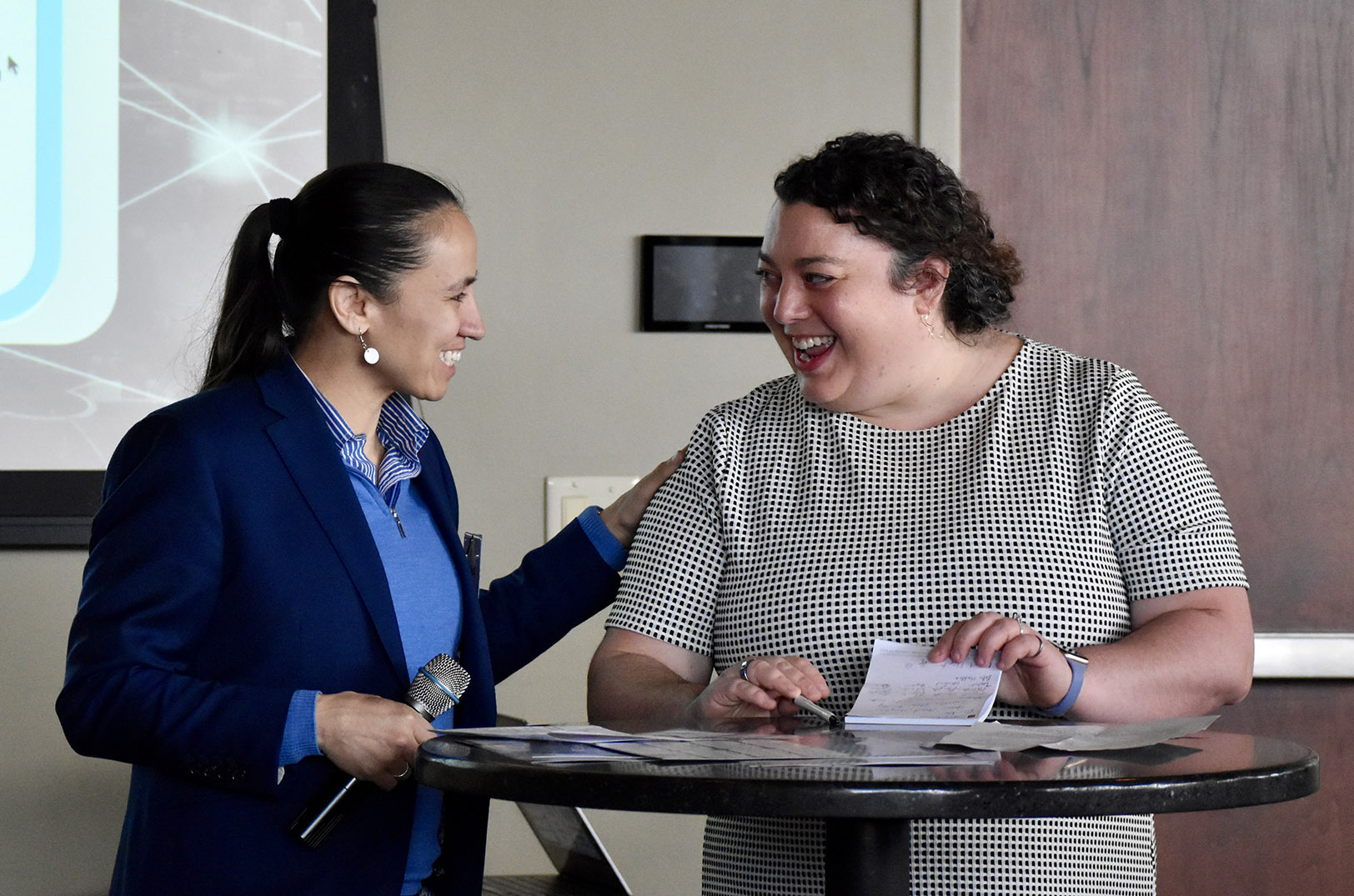 U.S. Rep. Sharice Davids, D-Kansas, and Melissa Roberts Chapman, the KC BioHub’s acting regional innovation officer, share a laugh during the celebration event at Boulevard Brewing; photo by Nikki Overfelt Chifalu, Startland News