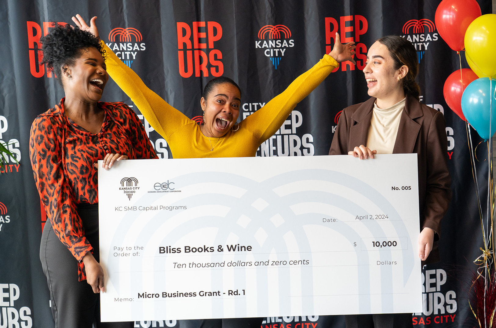 La’Nesha Frazier, Bliss Books and Wine, center, with Jana Wagner, KC BizCare, left, and Regina Sosa, EDCKC, right; photo courtesy of EDCKC