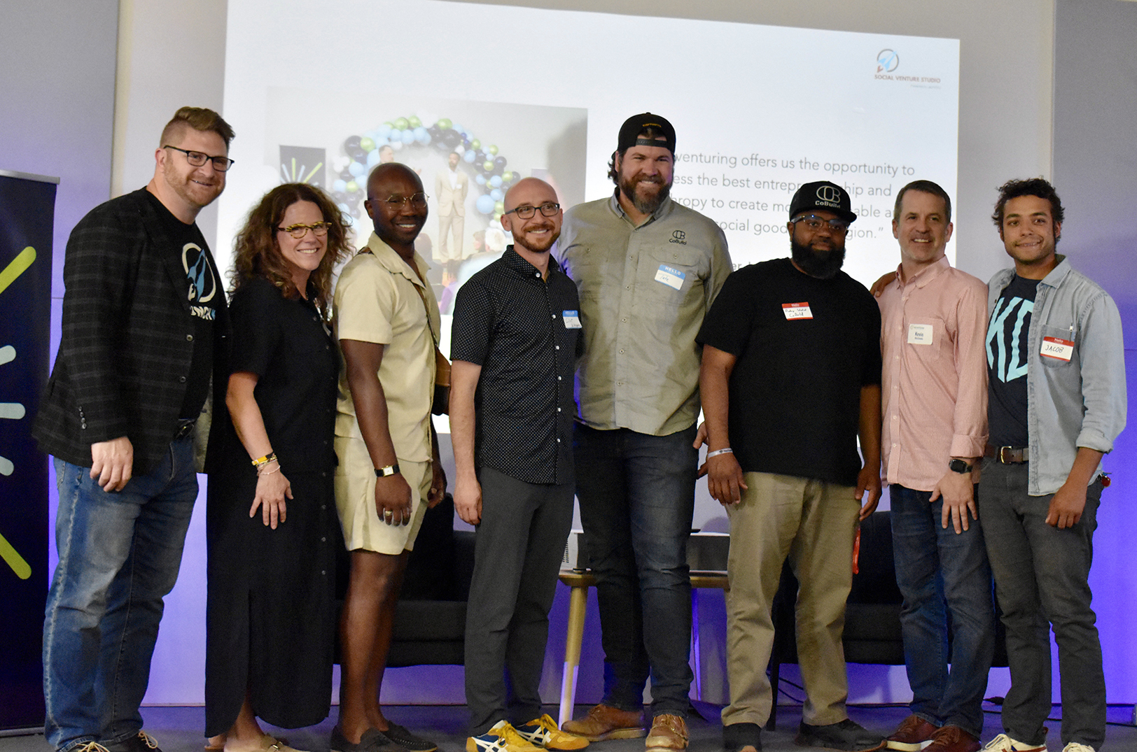 LaunchKC Social Venture Studio cohort members pose with organizers: Jim Erickson, EDCKC; Mandy Shoemaker, Connectivities; Godfrey Riddle, Civic Saint; Clint Velazquez, Base Academy of Music (BAM); Tate Williams and Rodney Woodard, CoBuild; Kevin McGinnis, Keystone Community Corporation; and Jacob Canyon Robinson Good Oak; not pictured: Terrell Jolley, Integrity Capital Management; and JQ Sirls and Herston Fails, Storytailor; photo by Nikki Overfelt Chifalu, Startland News