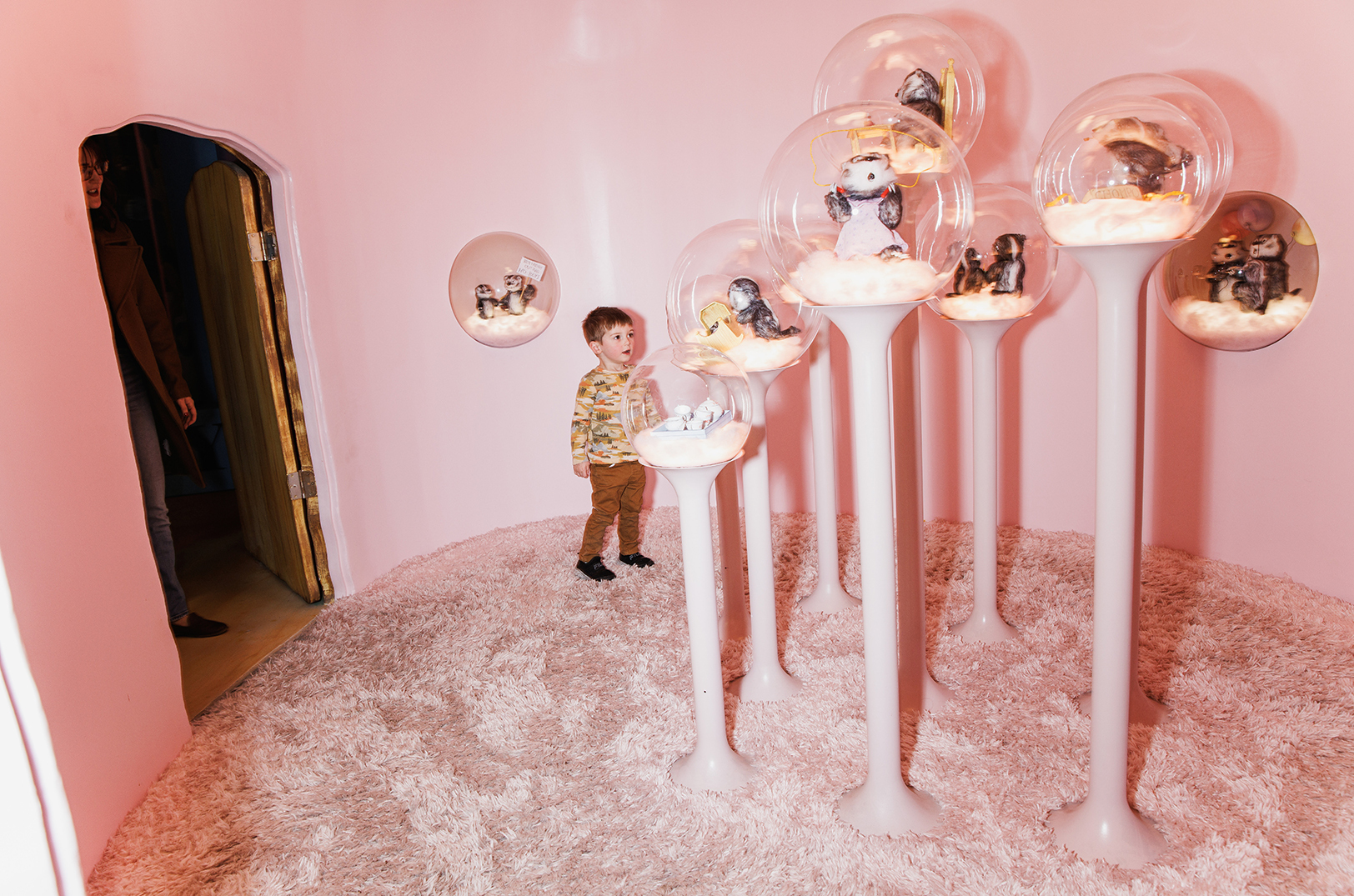 A boy and his mom check out scenes and figures from Russell Hoban’s Frances series at The Rabbit Hole in Kansas City, Missouri; photo by Chase Castor for The New York Times