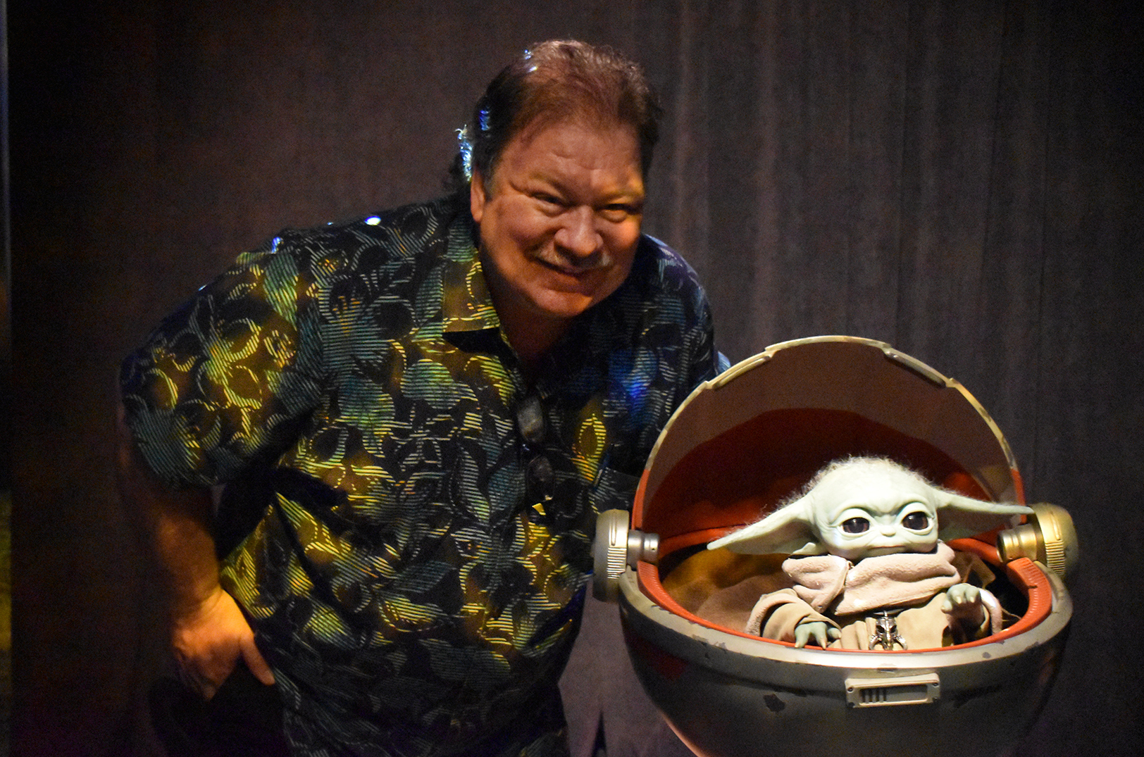 Garner Holt, Garner Holt Productions, with the Grogu animatronic during the opening weekend of the the Disney100: The Exhibition at Union Station; photo by Taylor Wilmore, Startland News