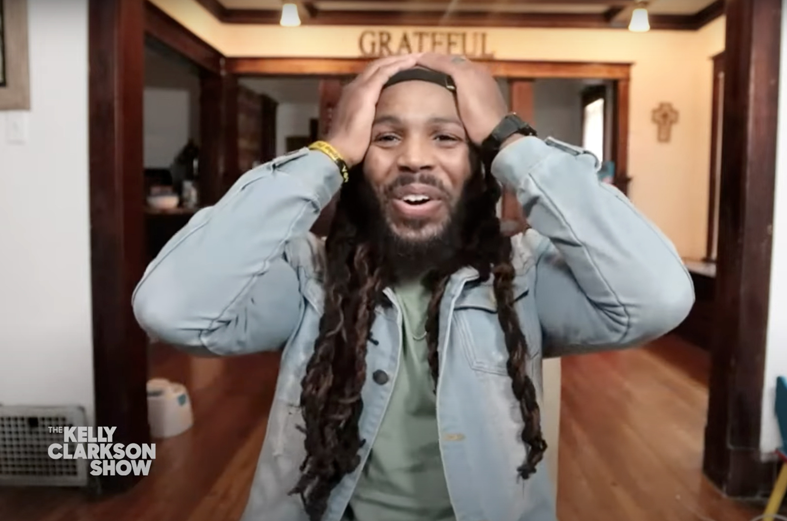 James Hogue reacts to Kelly Clarkson's gift announcement on the Kelly Clarkson Show; still courtesy of the Kelly Clarkson Show