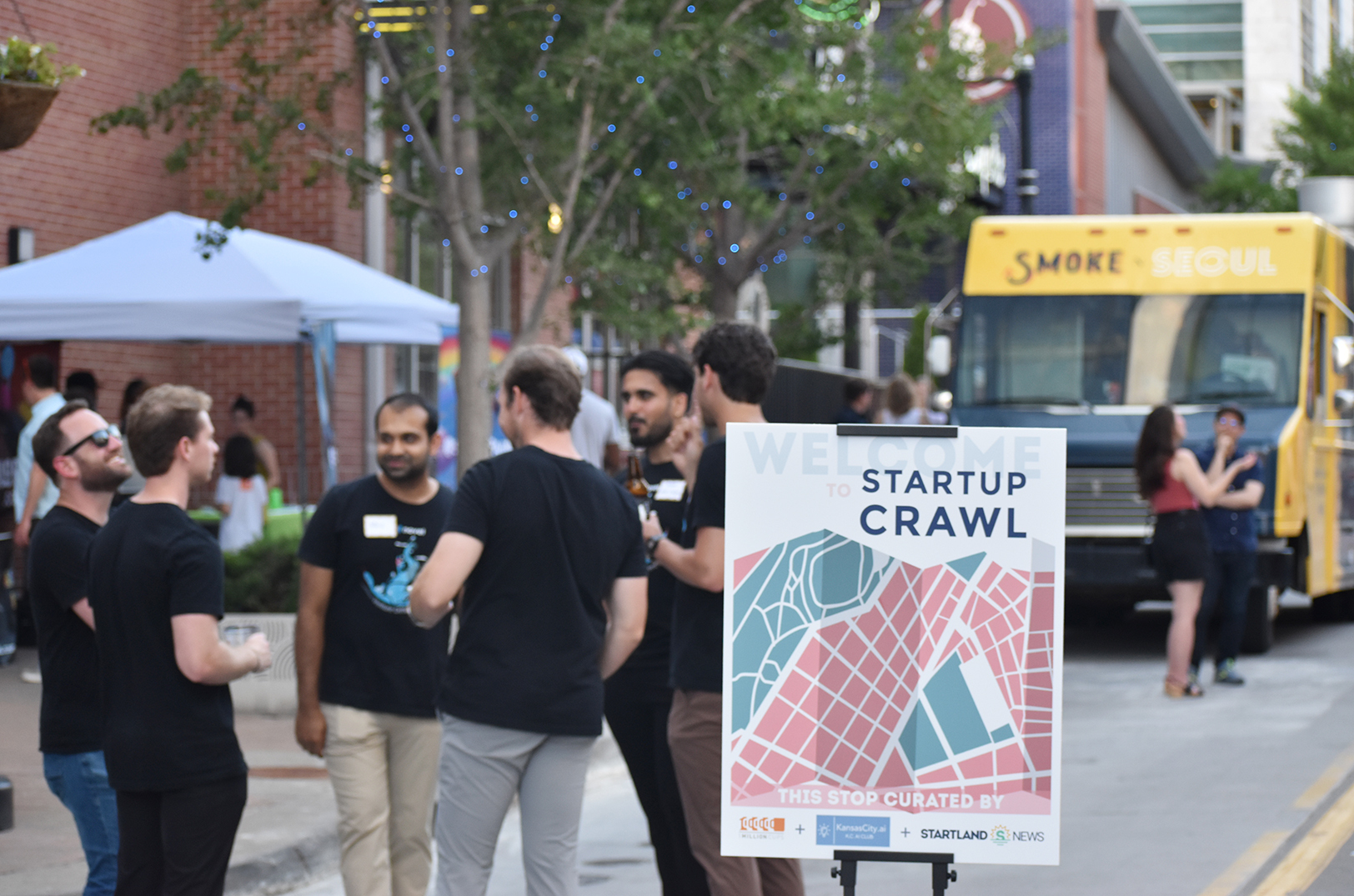 Startup Crawl attendees and vendors line Walnut Street downtown Kansas City's Power & Light District for the 2024 Startup Crawl; photo by Tommy Felts, Startland News