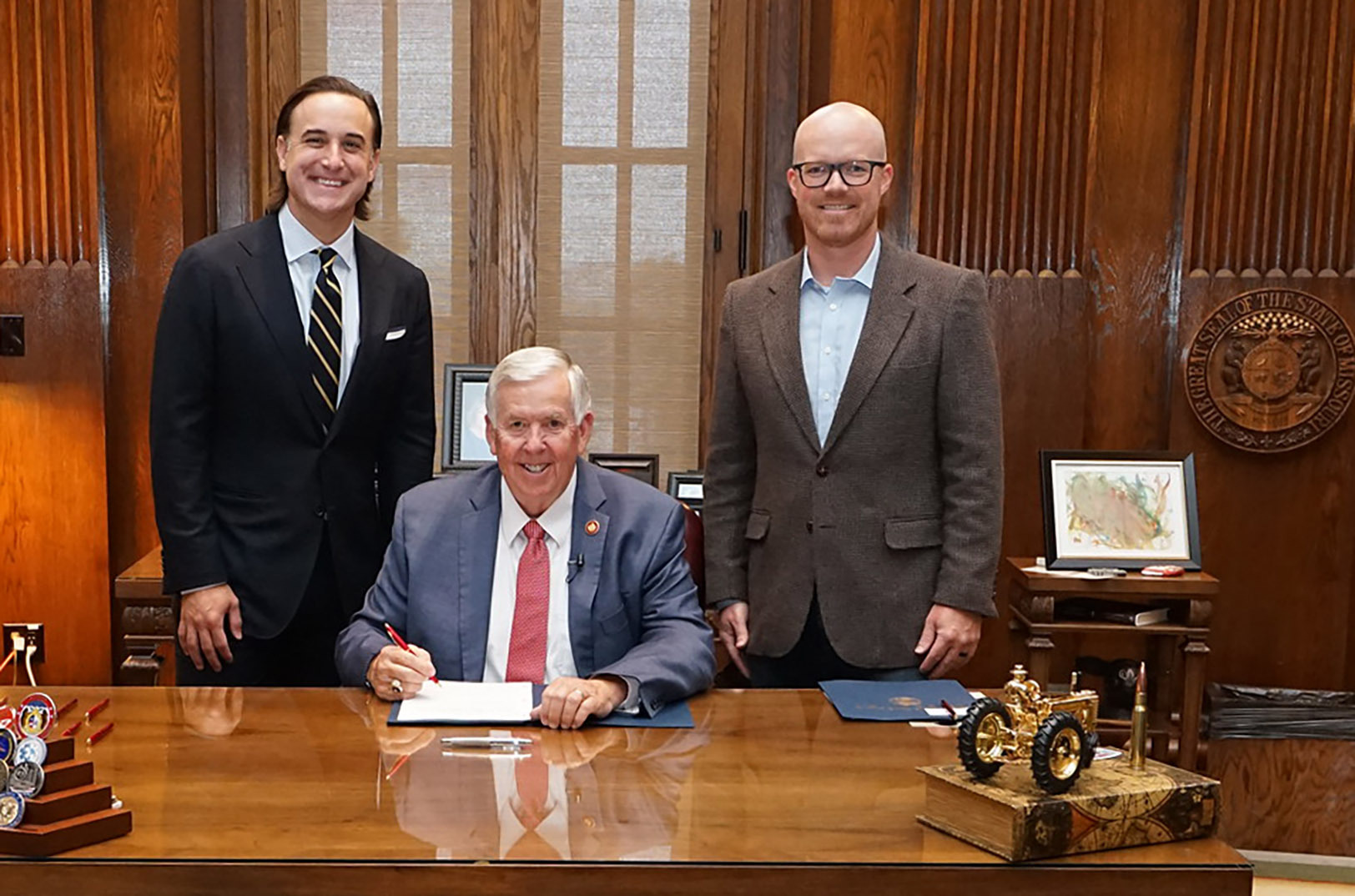 Jason Grill, chief government affairs officer for Right to Start; Gov. Mike Parson, R-Missouri; and Missouri Sen. Travis Fitzwater, R-Fulton; photo courtesy of Gov. Mike Parson's Office