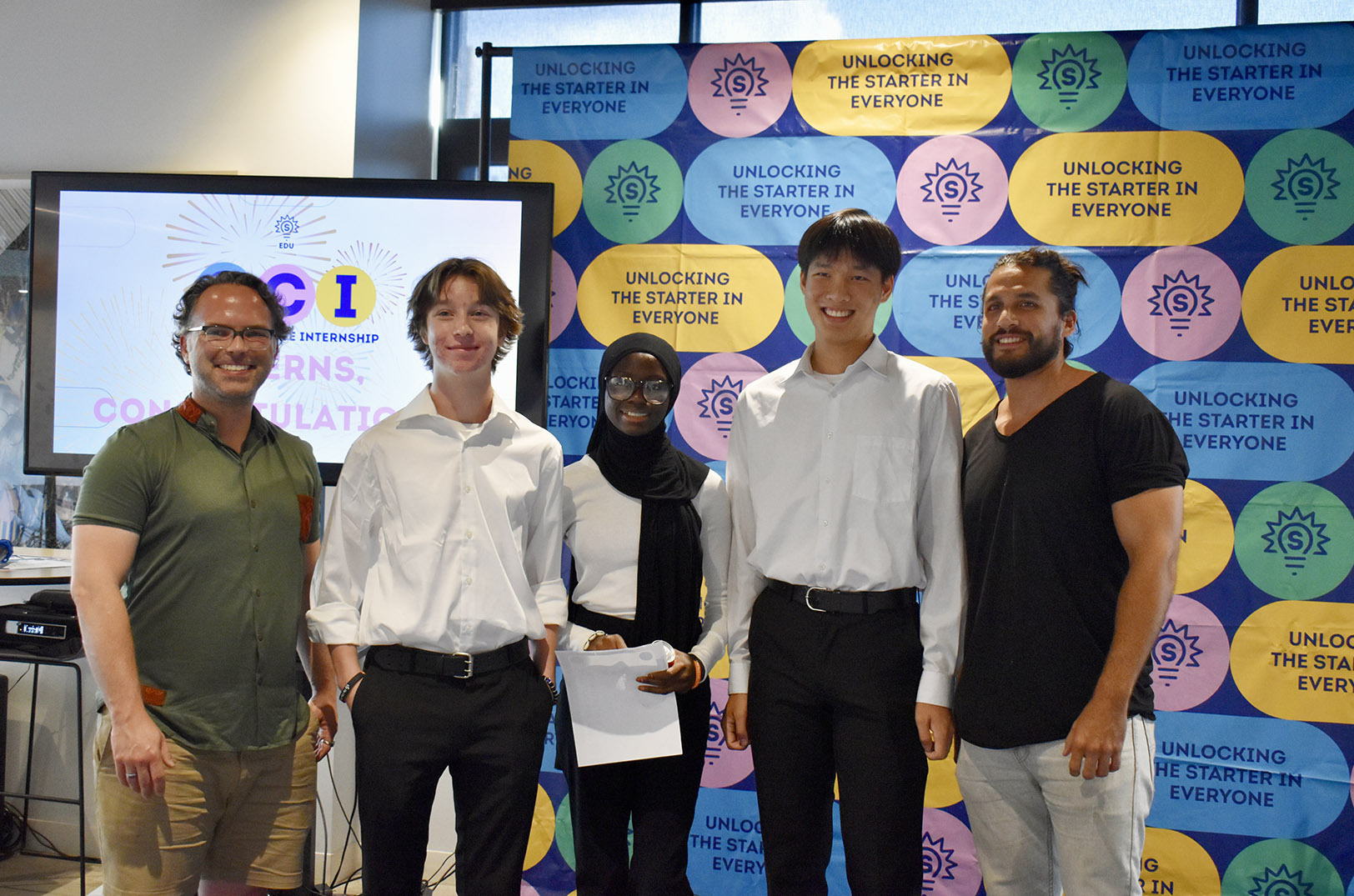 Team Pancho's Blanket poses with Jonathan Garvey, founder of Pancho's Blanket, at the summer Social Change Internship (SCI) showcase for participating ProX interns; photo by Taylor Wilmore, Startland News