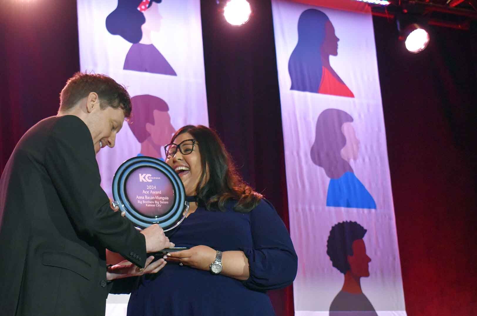Anna Bazan-Munguia, director of community outreach, Big Brothers Big Sisters Kansas City, accepts an Ace Award from Dr. Ronald Knight-Beck, KC Art Institute and a 2023 Ace Award winner, during the KC Chamber's POWER of Diversity Breakfast; photo by Taylor Wilmore, Startland News