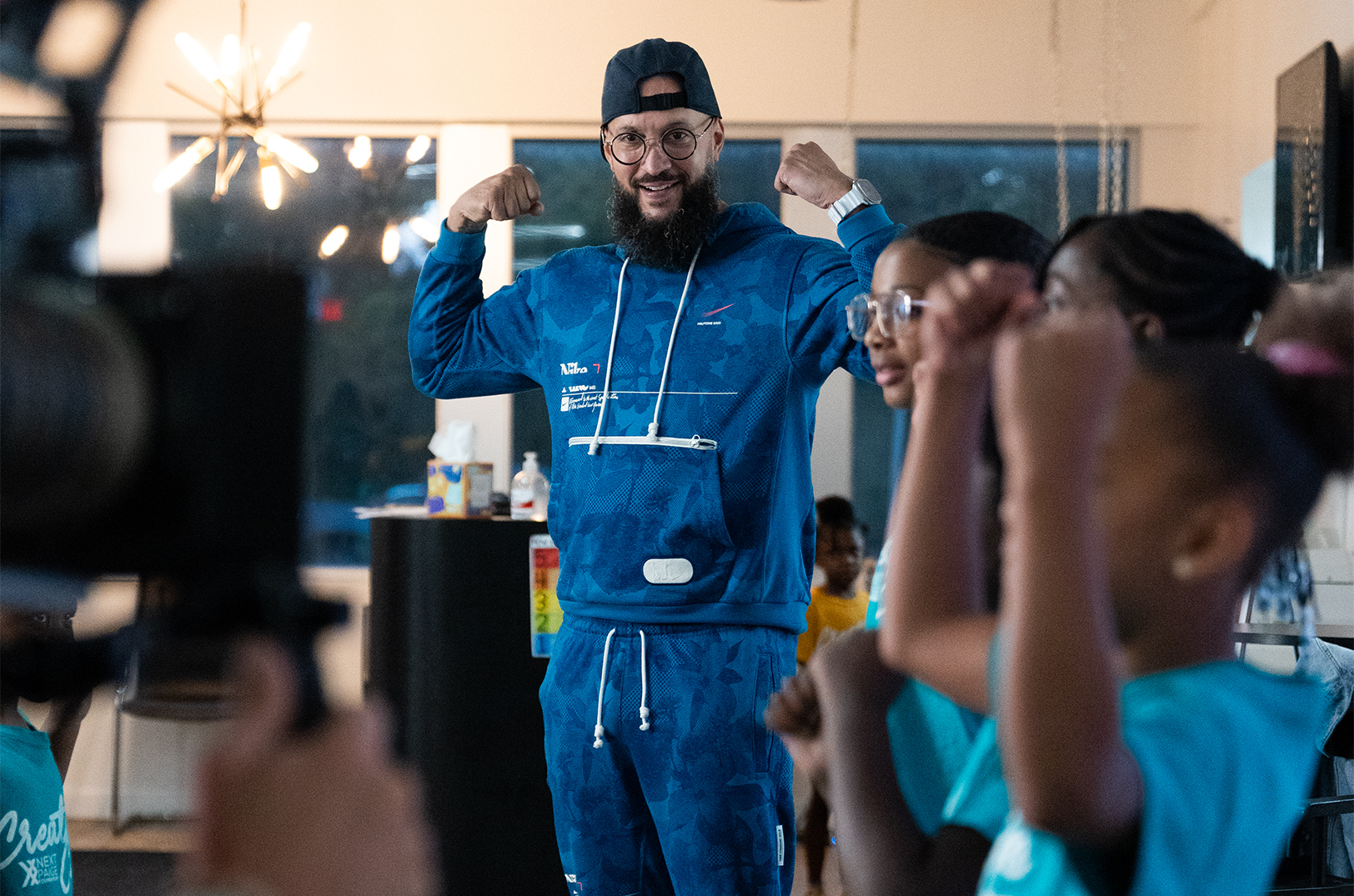 Roy Scott, Healthy Hip Hop, is pictured with young people during a photo shoot for the Catalyst grants program; photo courtesy of Catalyst, CTIA Wireless Foundation