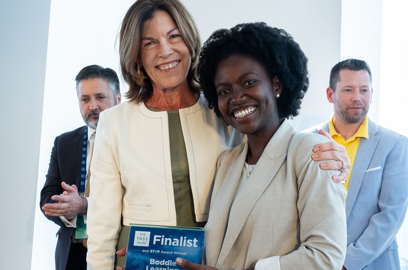 Janine Yass, founder of the Yass Prize, awards Edna Martinson, Boddle Learning, a 2024 Yass Prize Finalist Award; courtesy photo