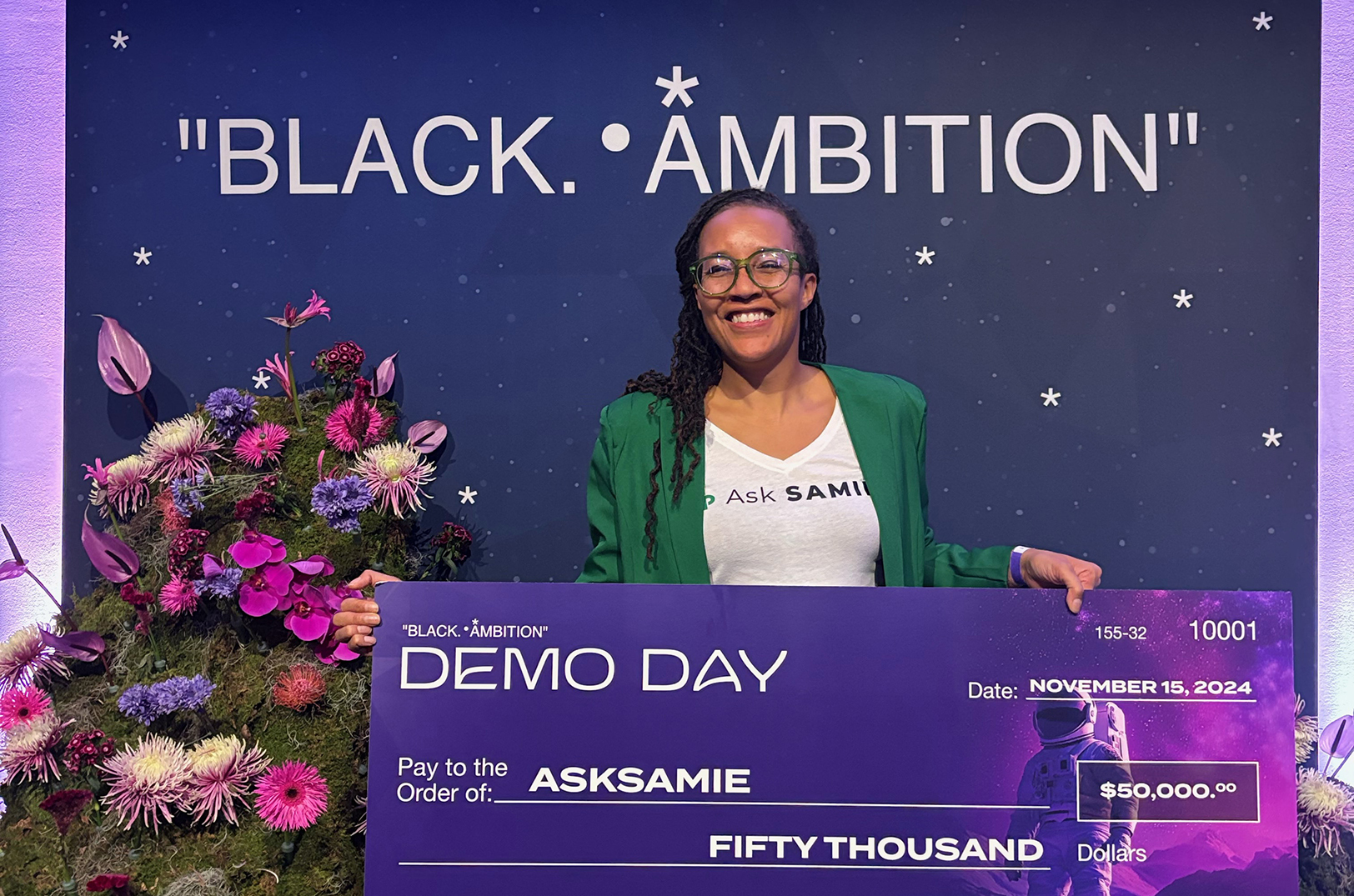 Dr. Brandy Archie, AskSAMIE, poses with her  Black Ambition prize check; courtesy photo