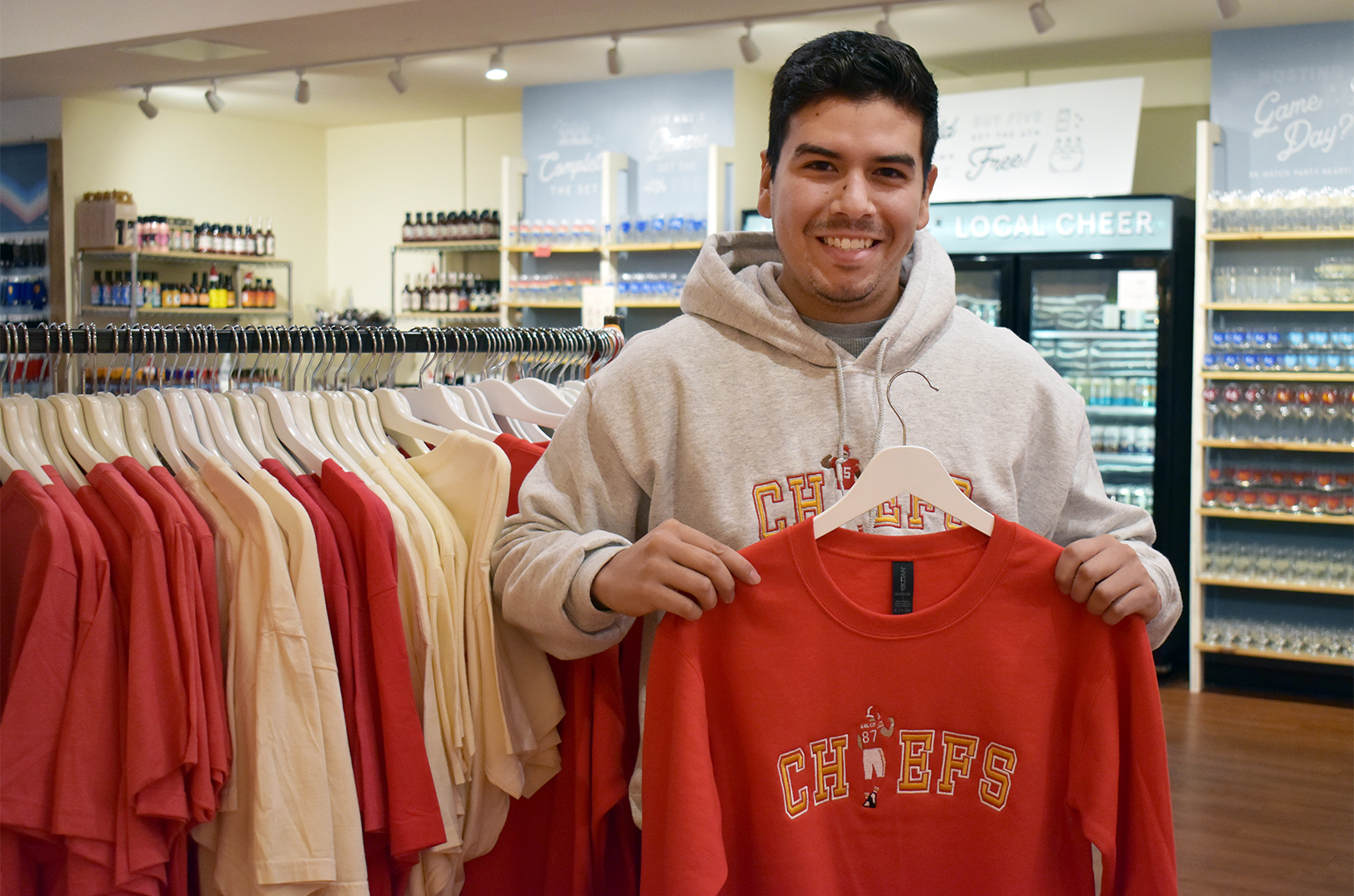 Enrique Hernandez, Craft E. Embroidery, holds one of his most popular designs inside Made in KC's Country Club Plaza marketplace; photo by Taylor Wilmore, Startland News