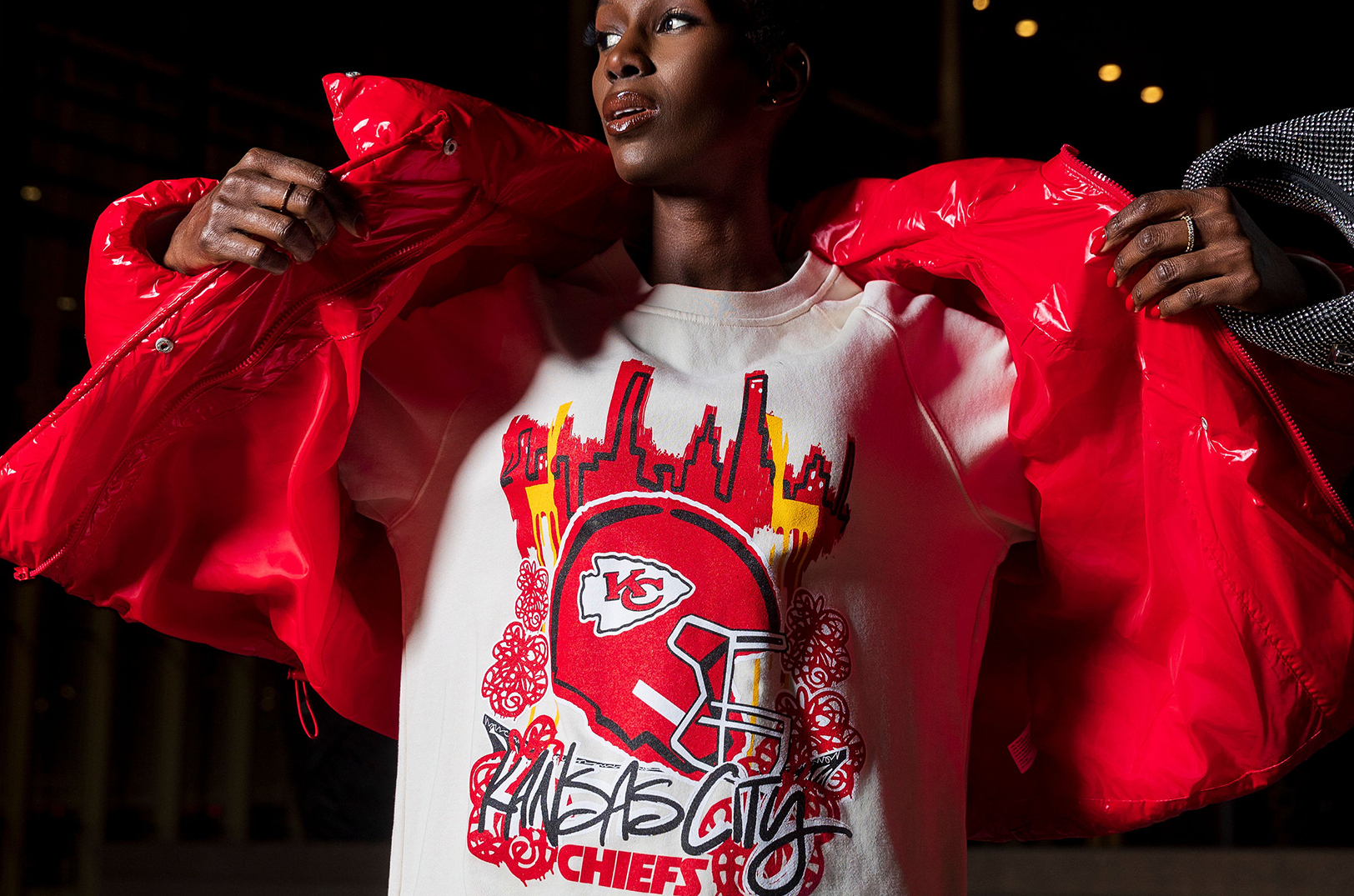 Model Dieynaba Diop sports the Chiefs NFL Graphic Oversized Crew Sweatshirt from the Chiefs x Cherry campaign's “Blossoming Grit Red Collection”; courtesy photo