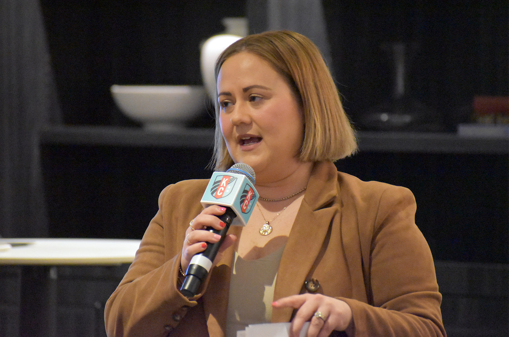 Kara Lowe, CEO of the KC Tech Council, speaks to stakeholders and partners about the KC TechBridge project during a kickoff event at CPKC Stadium; photo by Tommy Felts, Startland News